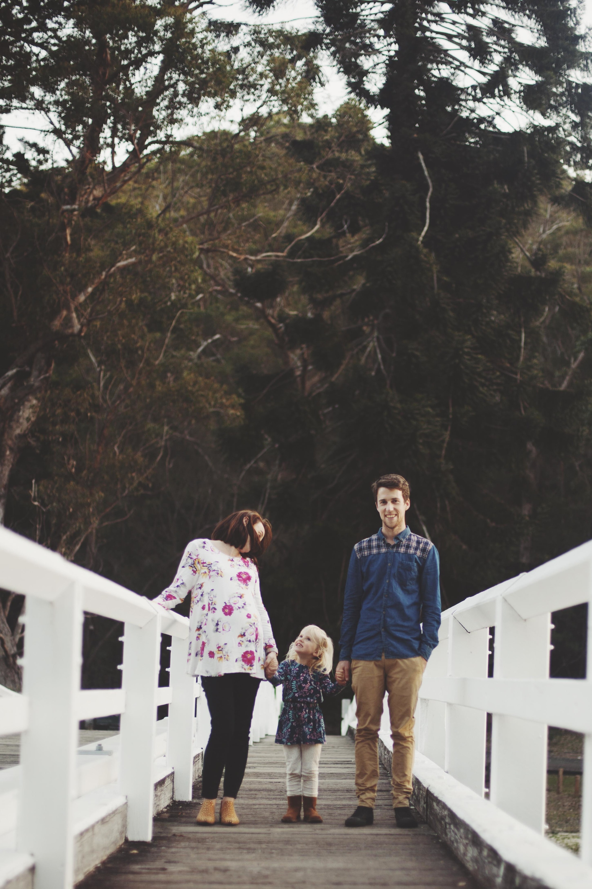 family walking on wooden bridge in sydneys royal national park