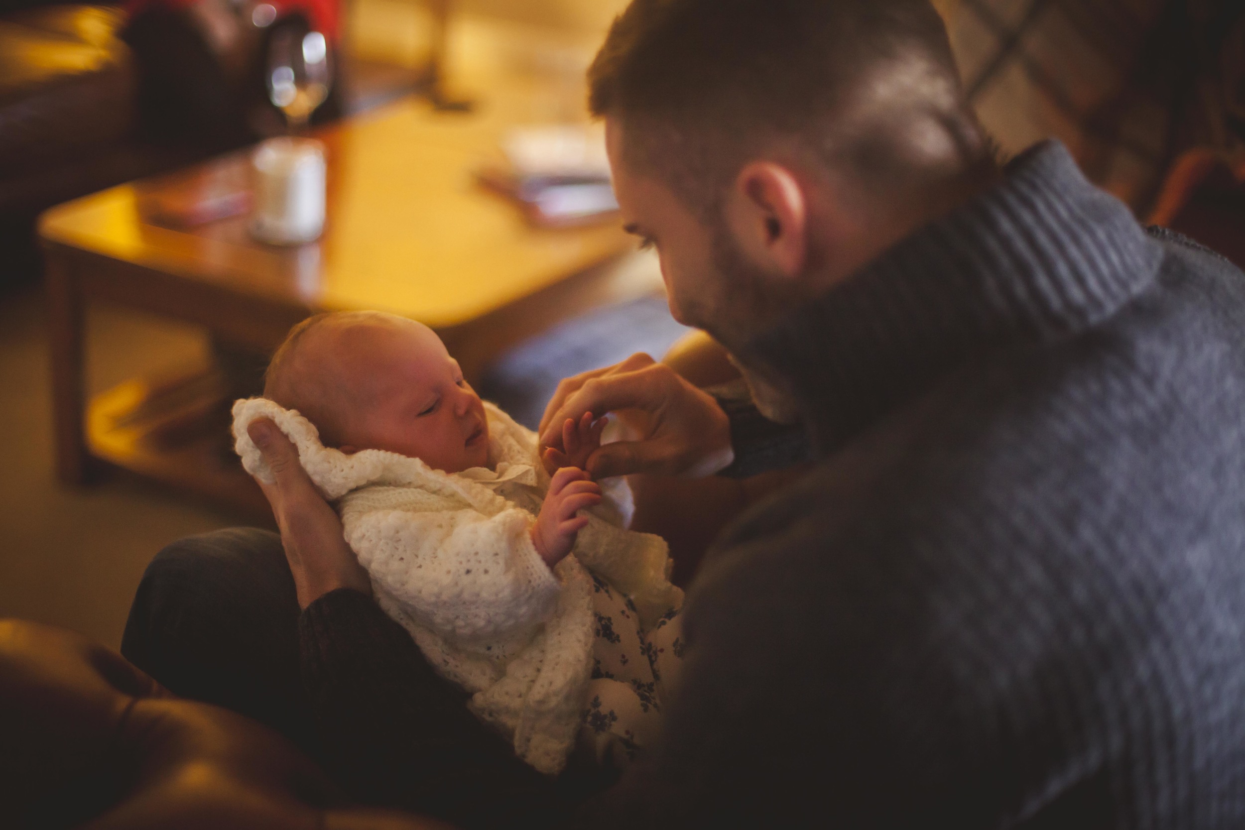 father holding newborn