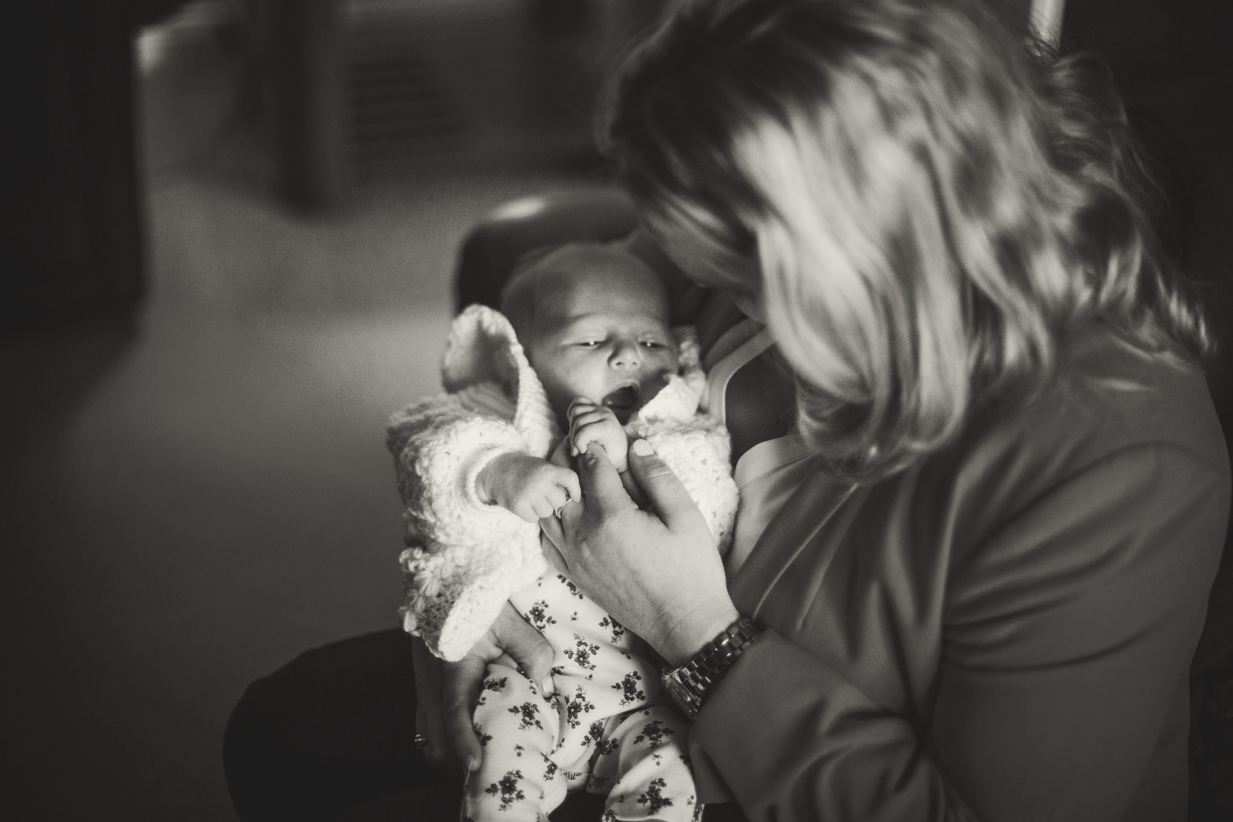 mother holding newborn baby