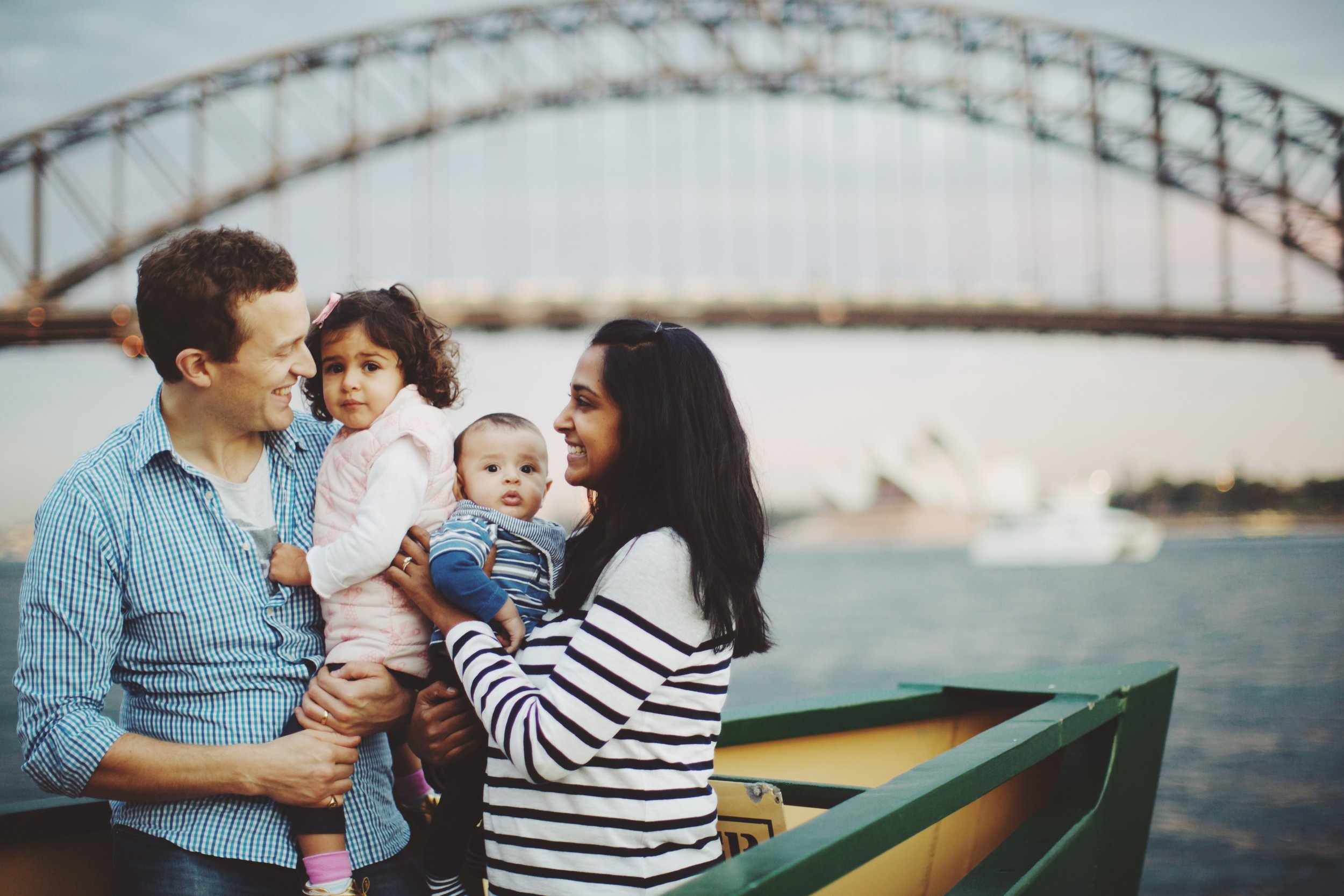 Family walking by harbour in Sydney