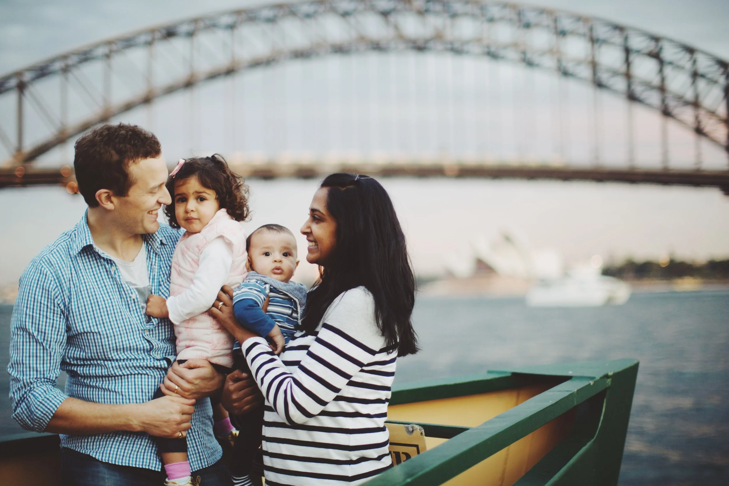 Family walking by harbour in Sydney