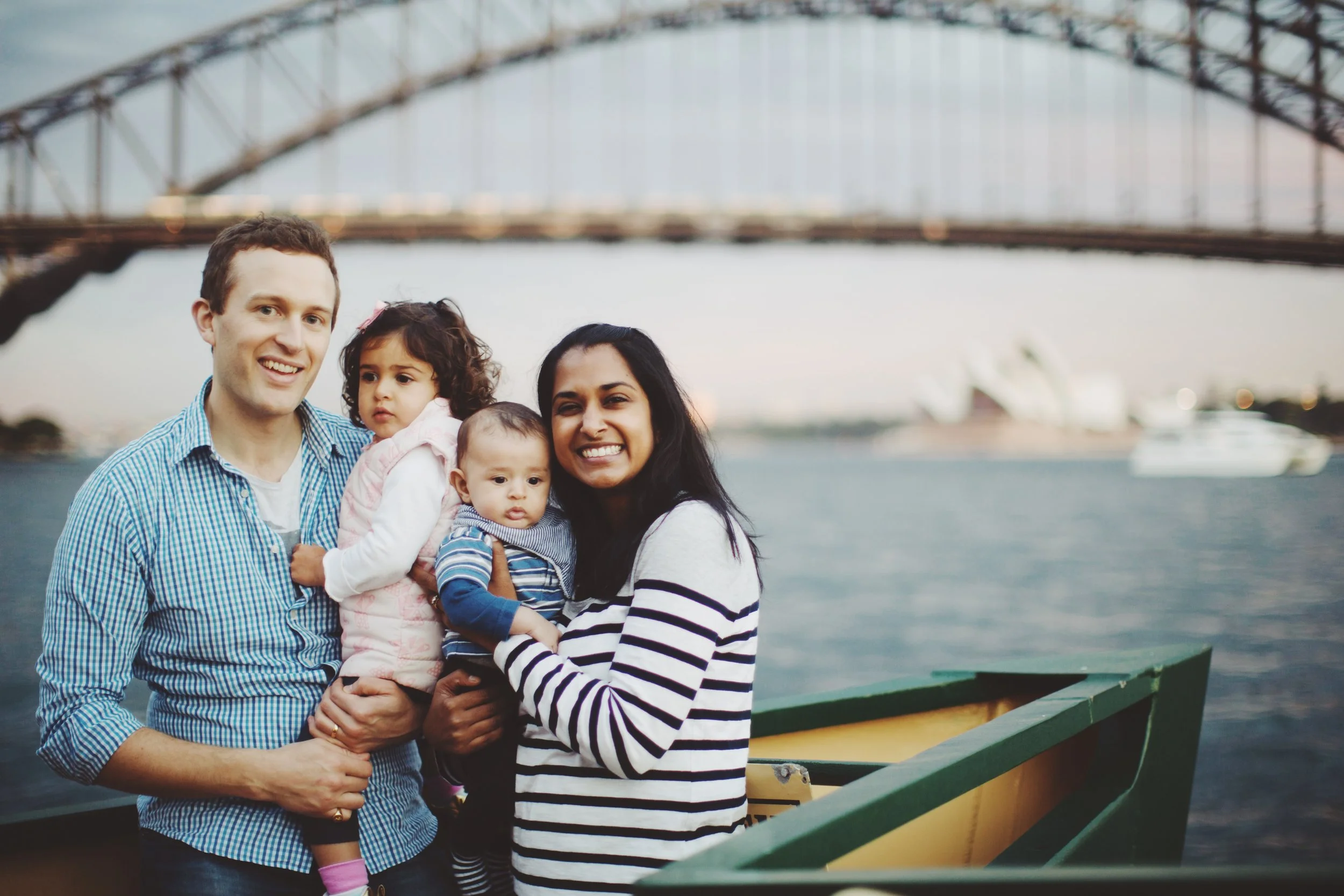 Family walking by harbour in Sydney