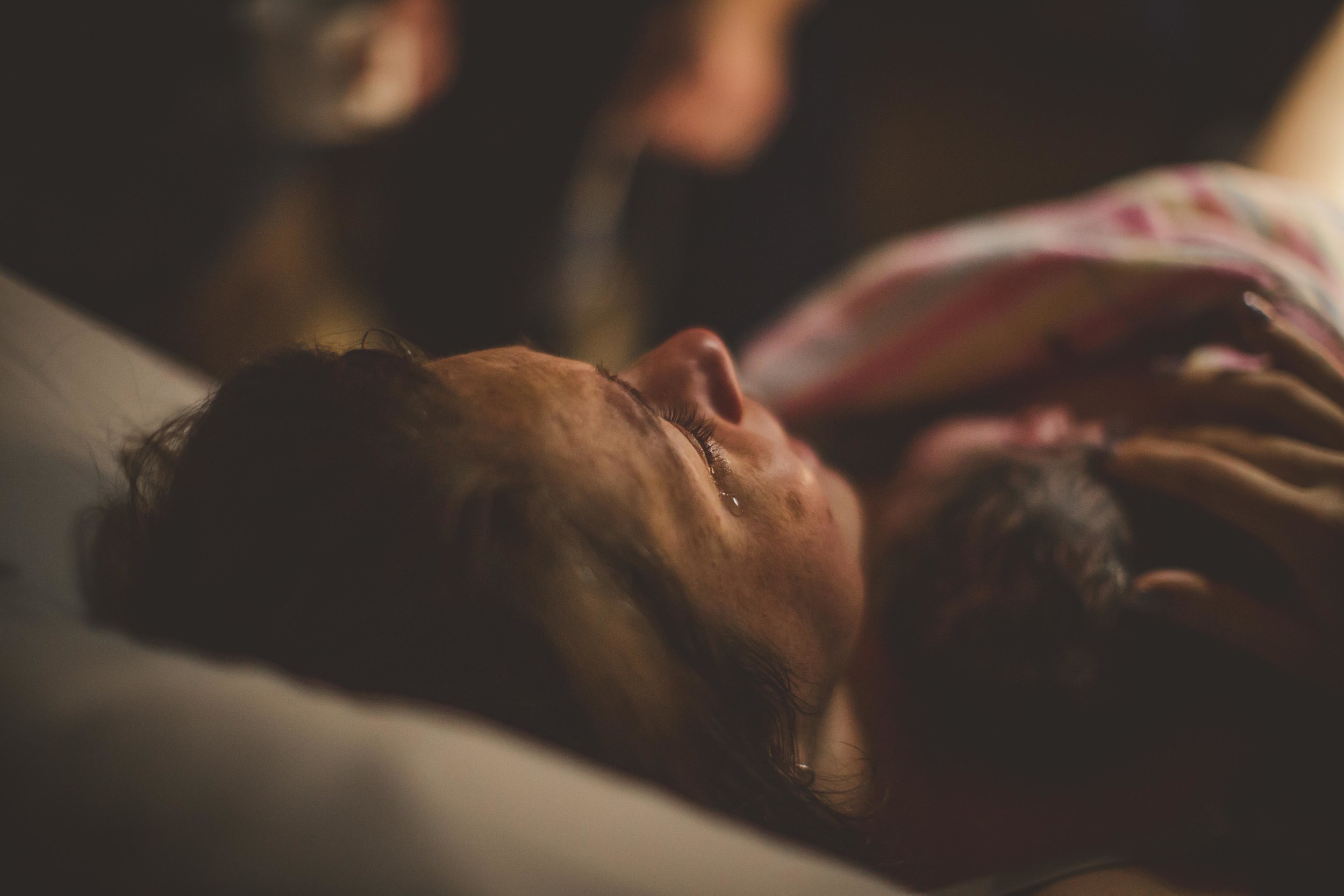 newborn resting on mother's chest after birth