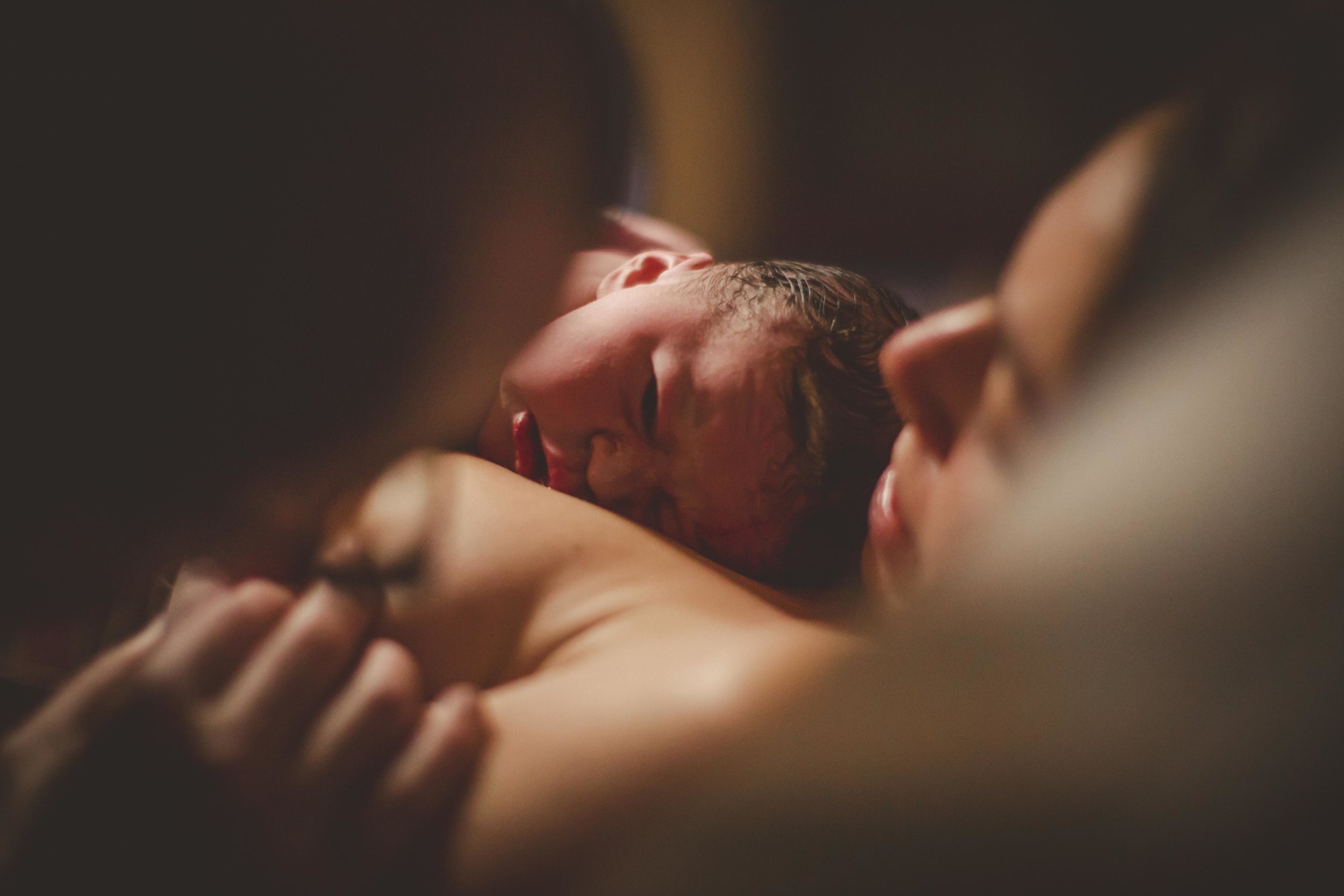 newborn resting on mother's chest after birth