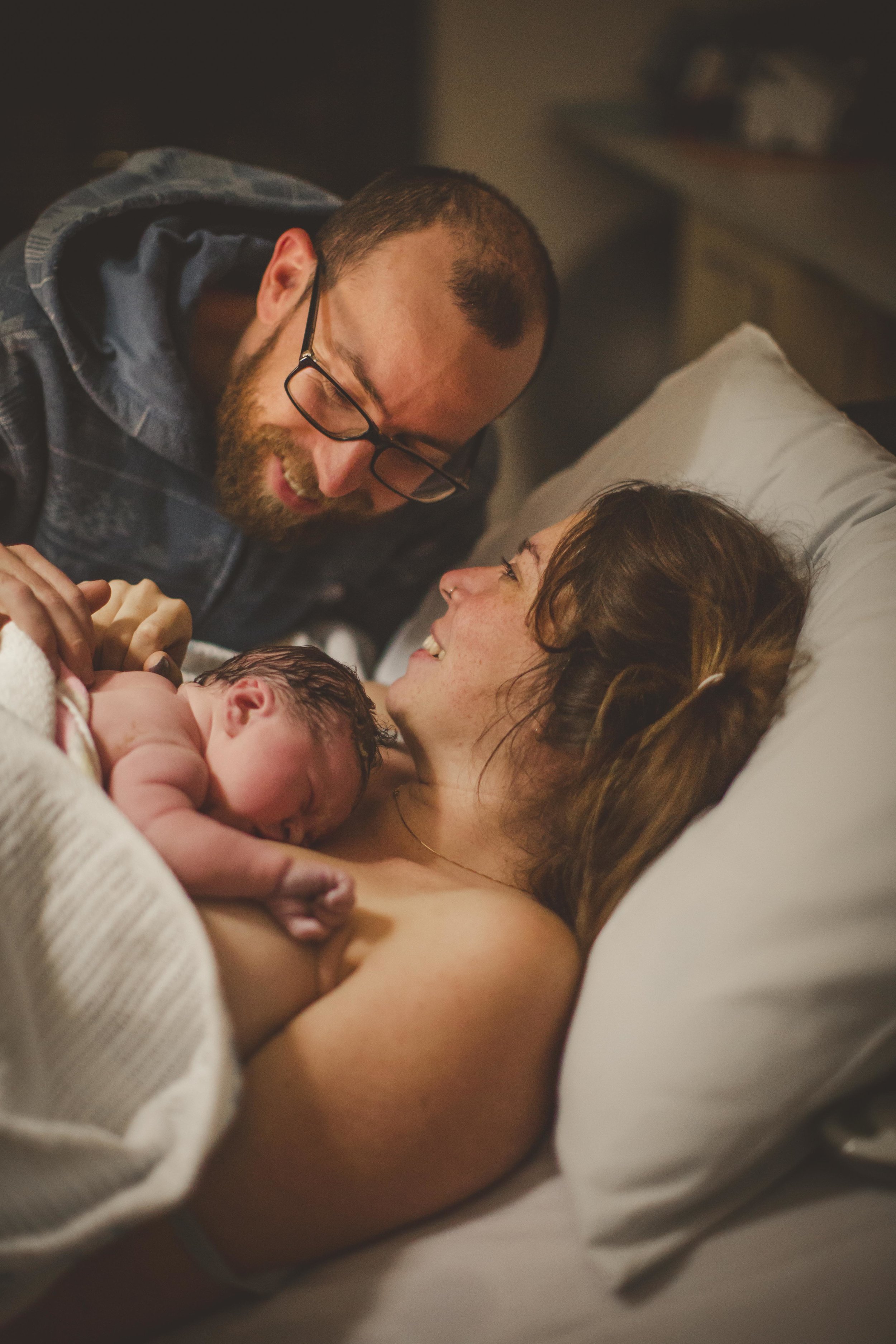 newborn resting on mother's chest after birth