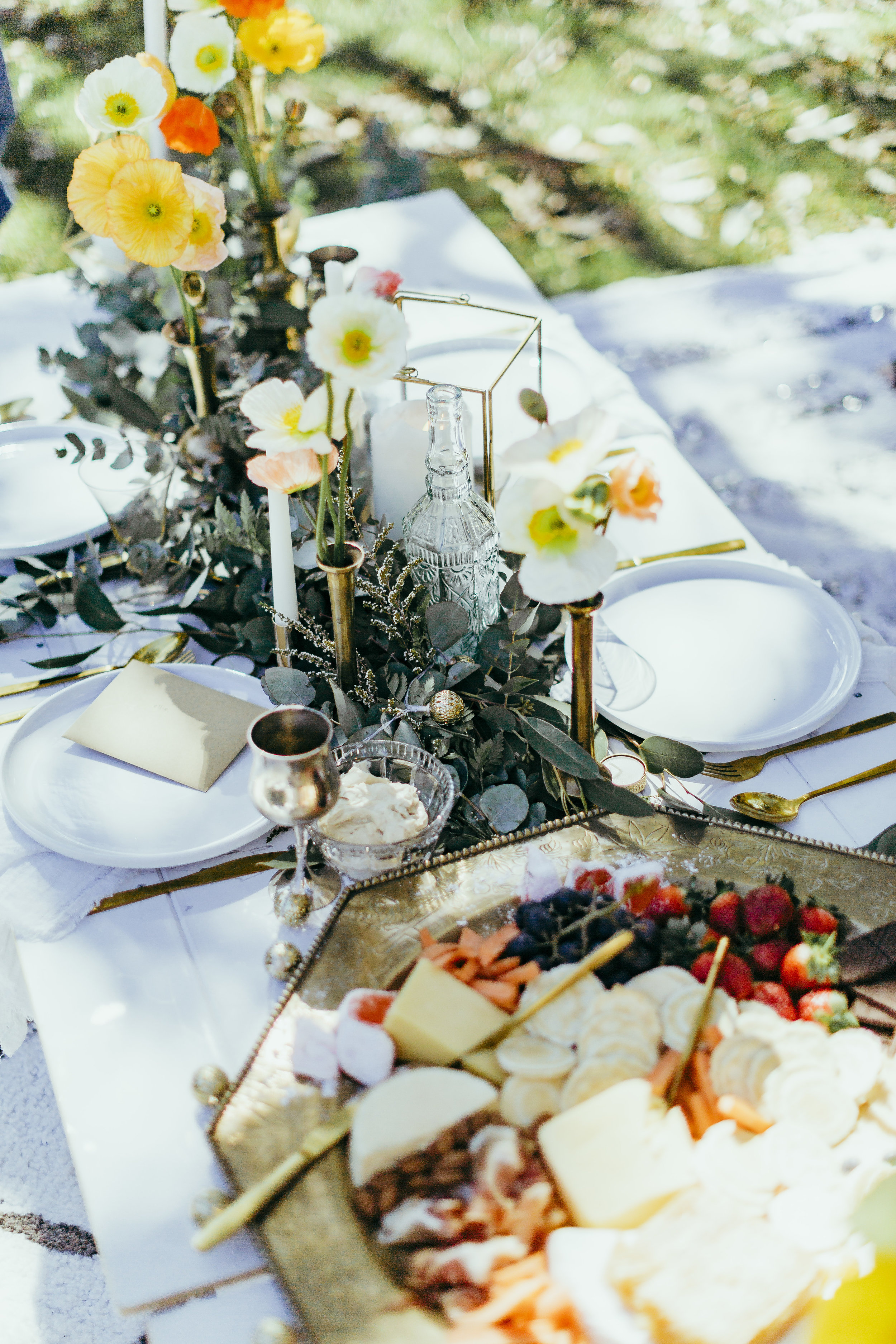 Birthday party styled with floral table settings, grazing plates, chocolate meringue, flower crowns and confetti