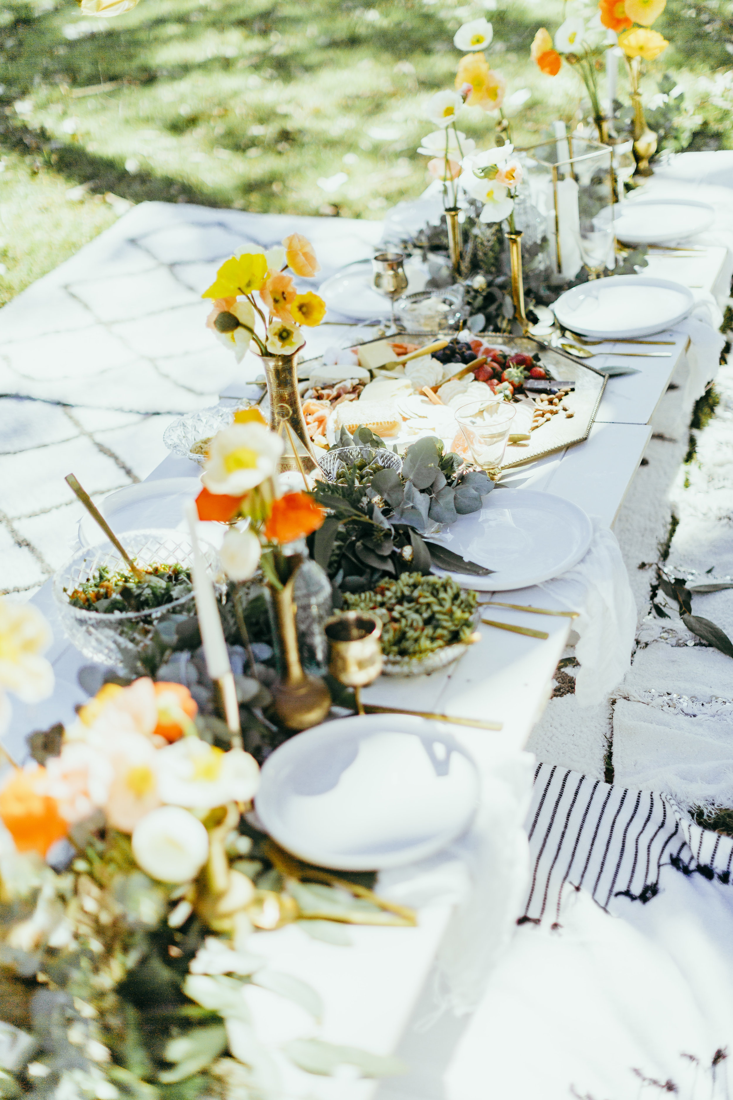 Birthday party styled with floral table settings, grazing plates, chocolate meringue, flower crowns and confetti
