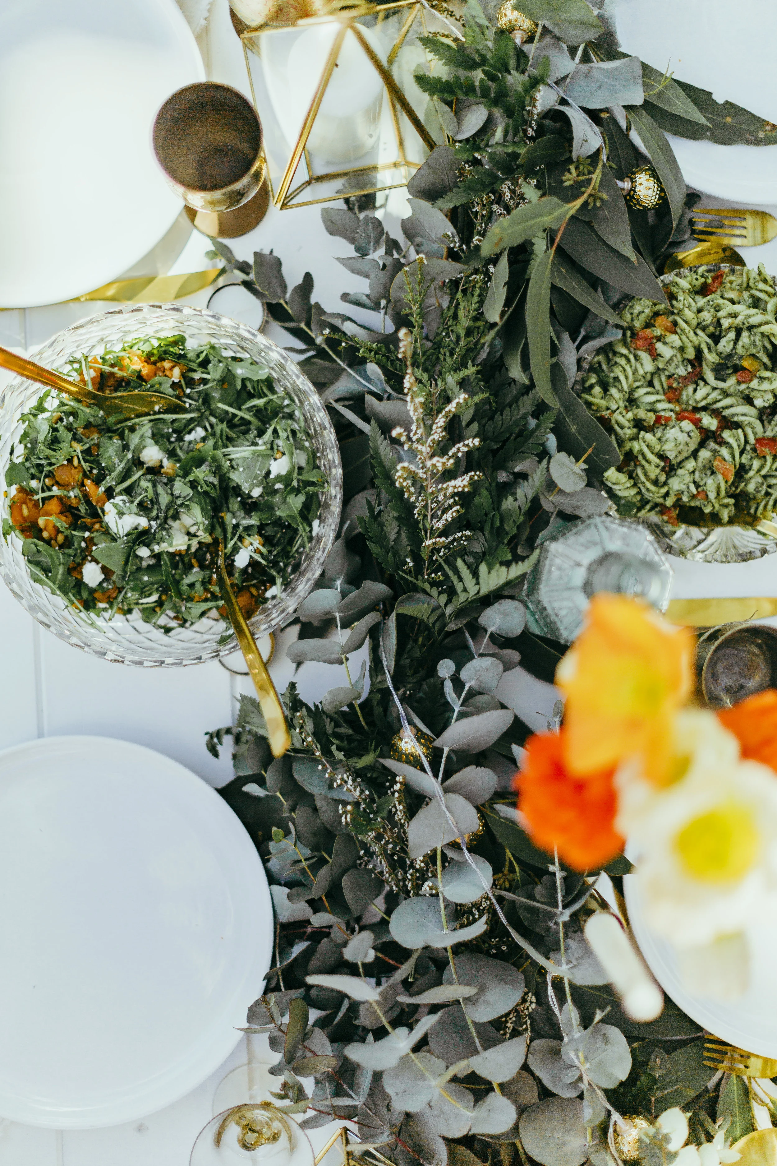 Birthday party styled with floral table settings, grazing plates, chocolate meringue, flower crowns and confetti