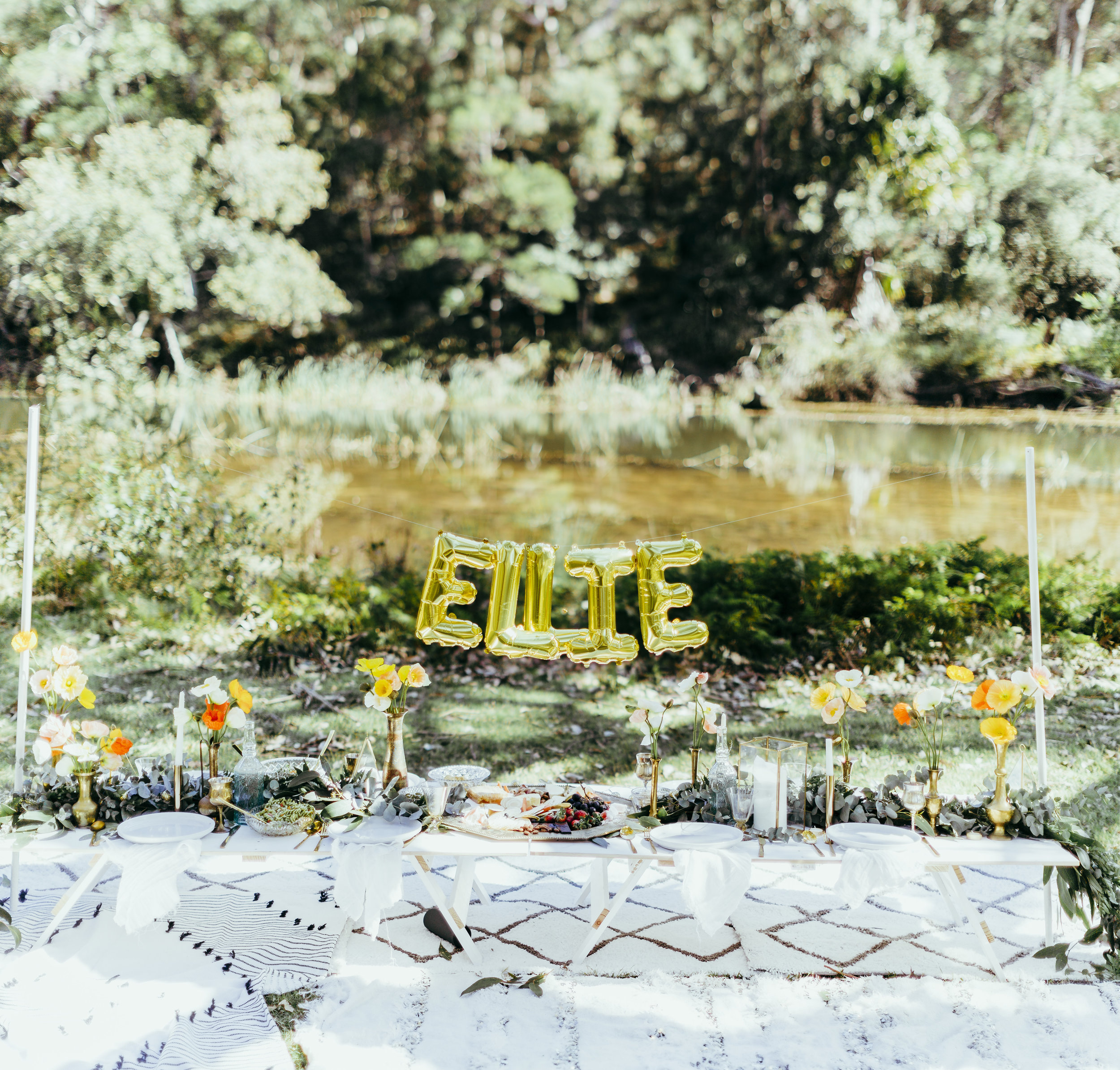 Birthday party styled with floral table settings, grazing plates, chocolate meringue, flower crowns and confetti