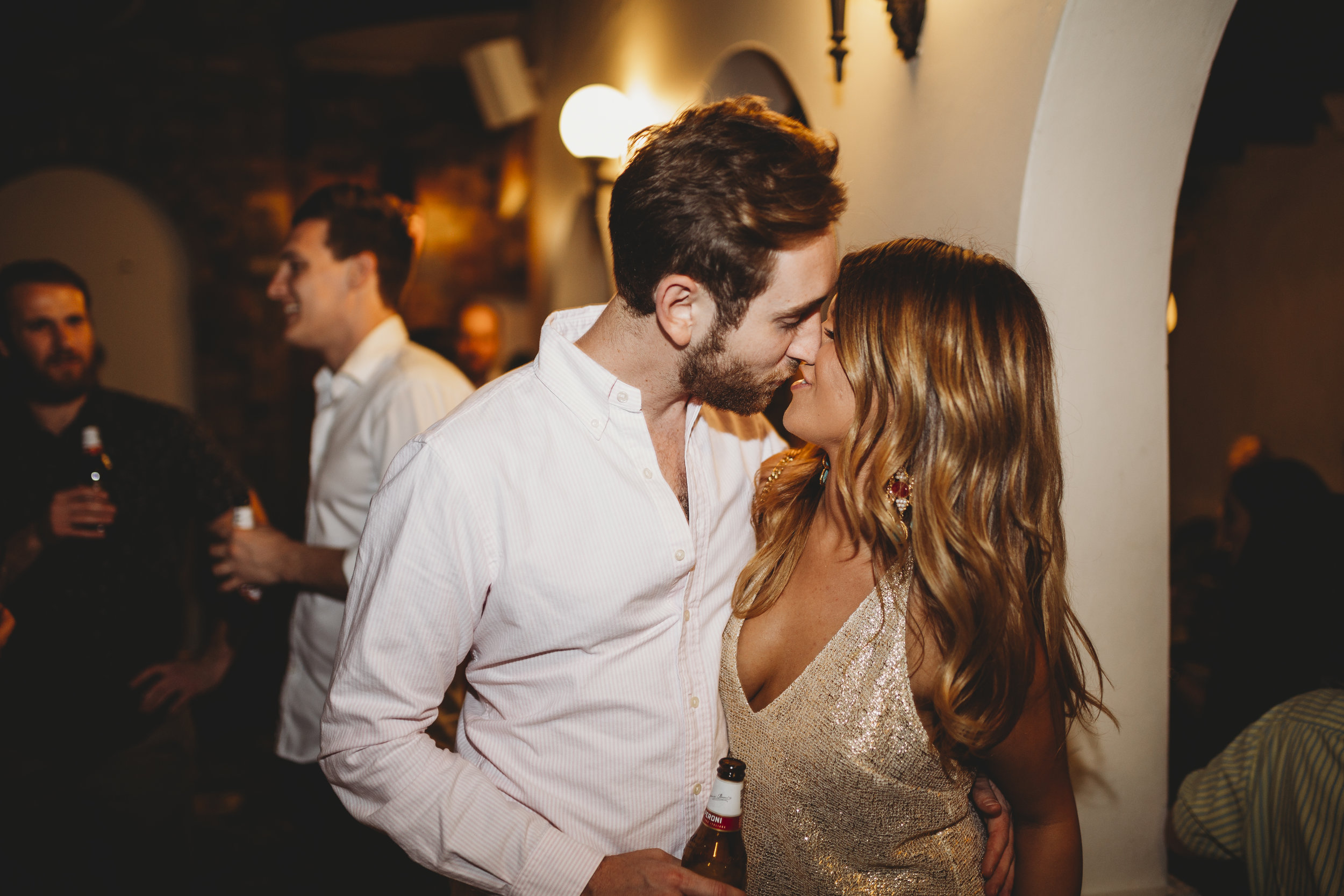 Young couple kissing at party