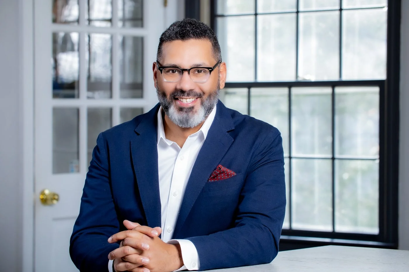 Executive headshot of a man dressed in a business suit