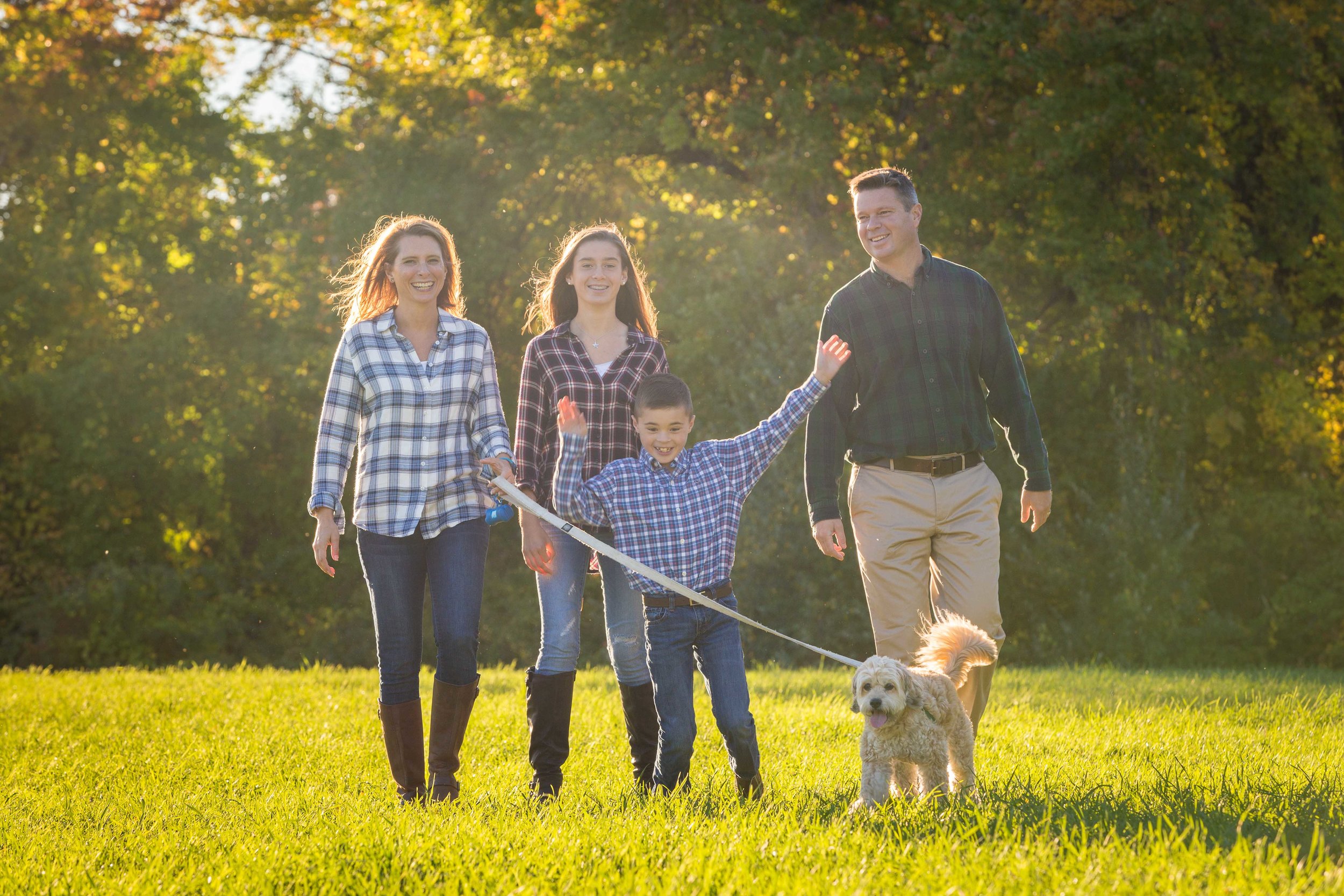 Family and their pet dog enjoying their time together 
