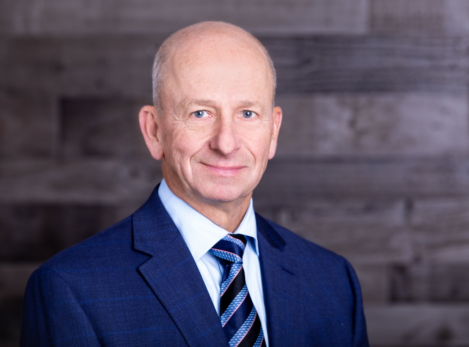 Man wearing blue suit and tie