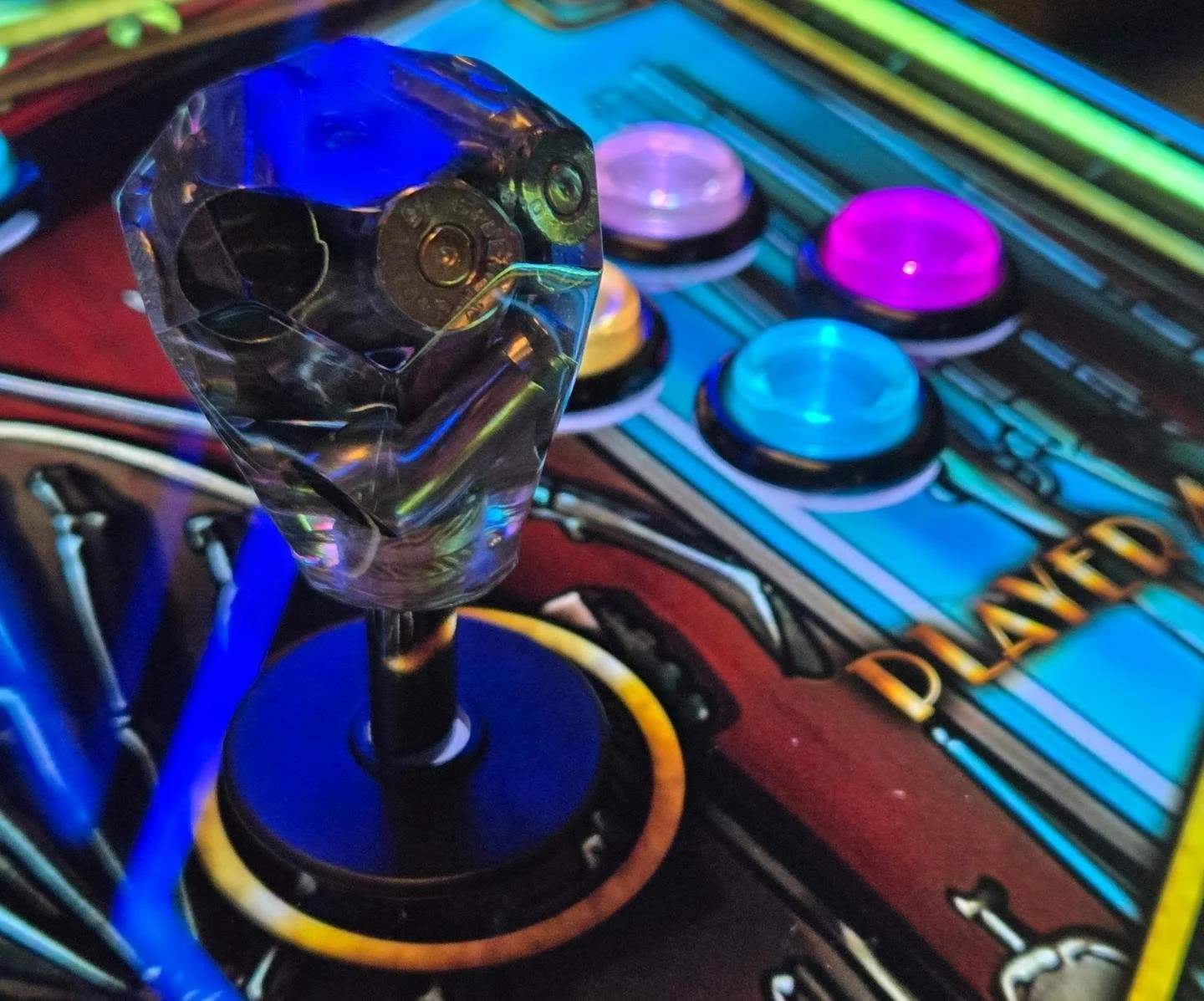 Custom bullet casing balltops on this upcoming cabinet. Can anyone guess the theme??