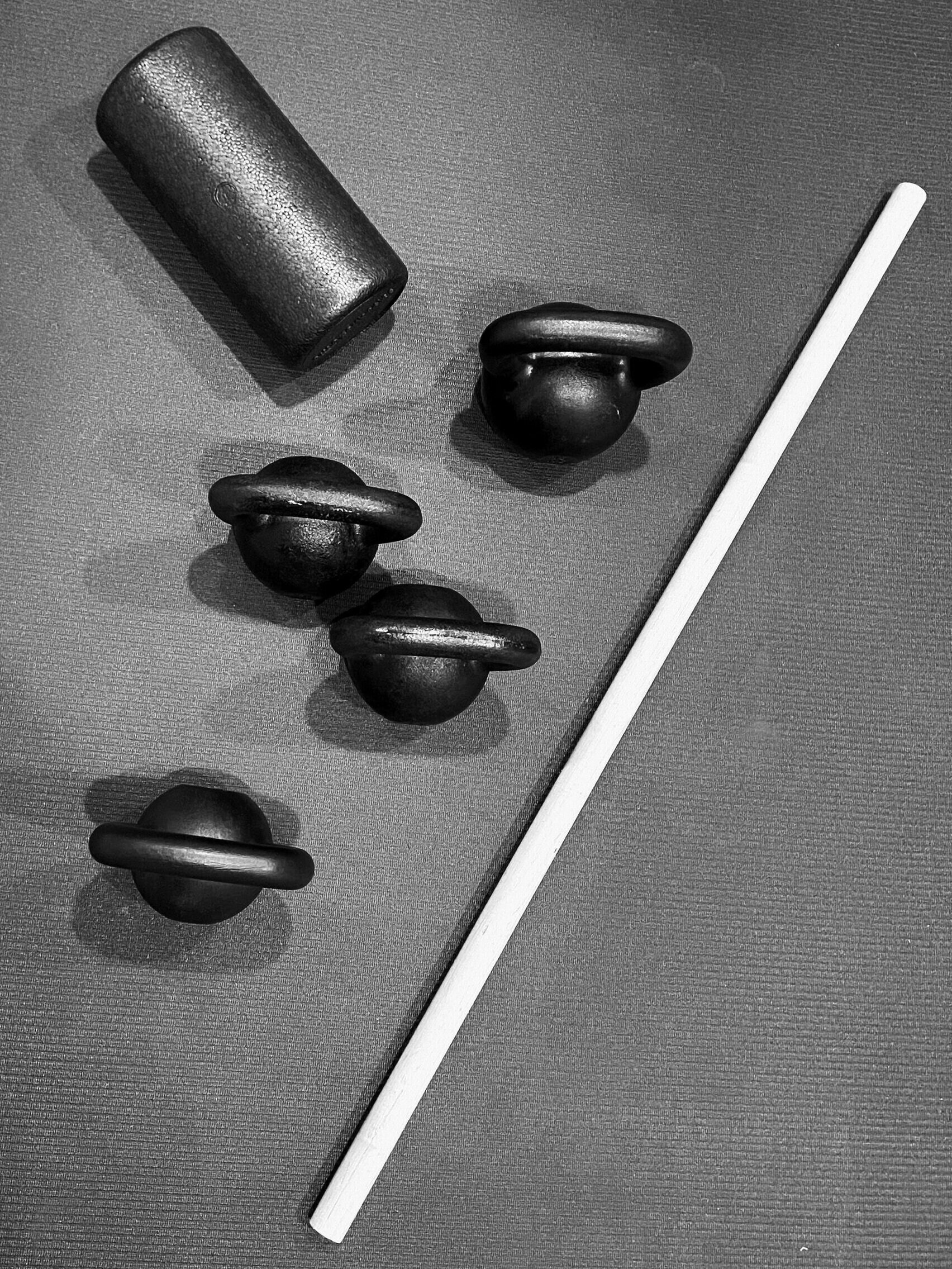 Kettlebells, foam roller, and dowel for online coaching and at-home strength training