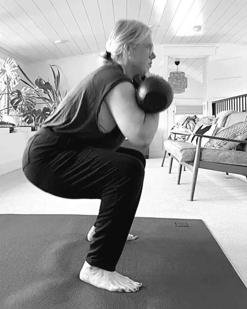 Longtime EDK online coaching student practicing kettlebell training at home