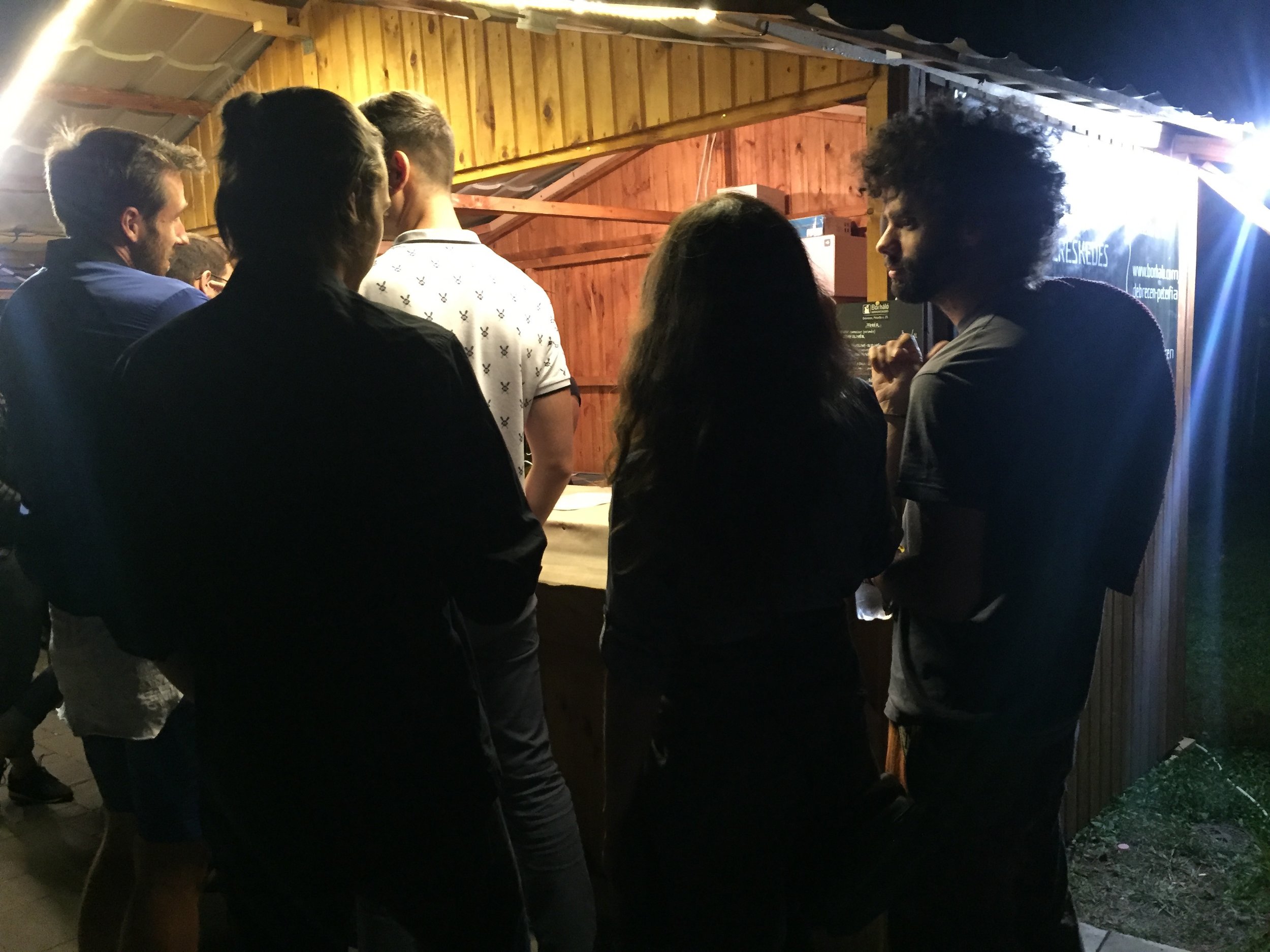 Piotr, Shiva and Szabi looking for something to drink that isn't beer.