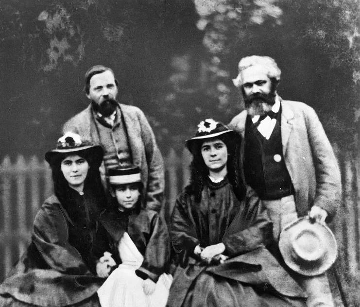 Eleanor Marx (front centre) in 1864 with her sisters Laura and Jenny. Behind are Frederick Engels and their father Karl Marx