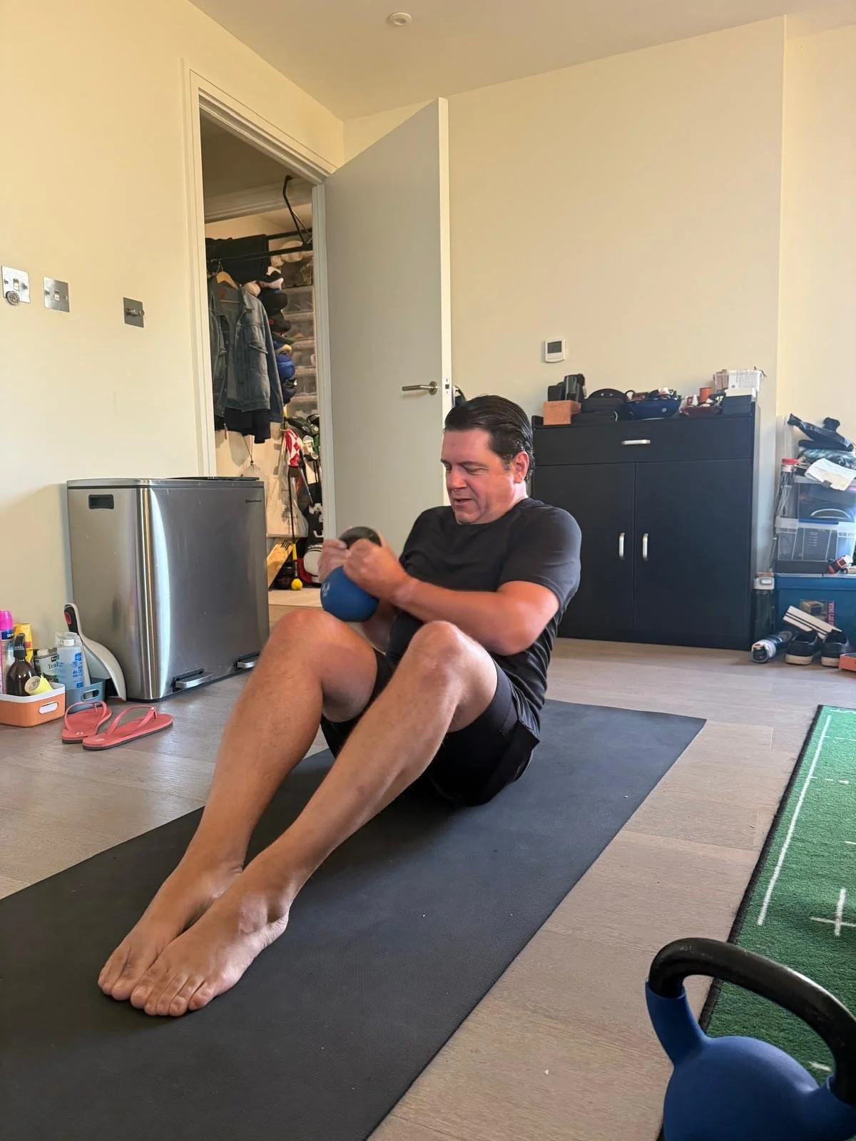 Mobile personal trainer Zara Smalley leading a home workout in Battersea