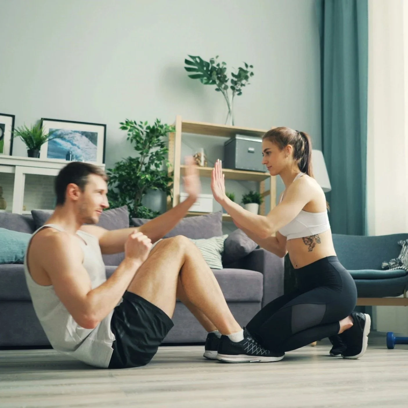 Mobile personal trainer coaching a client with dumbbells during an in-home PT session in Nine Elms SW8 — one-to-one personal training at your door