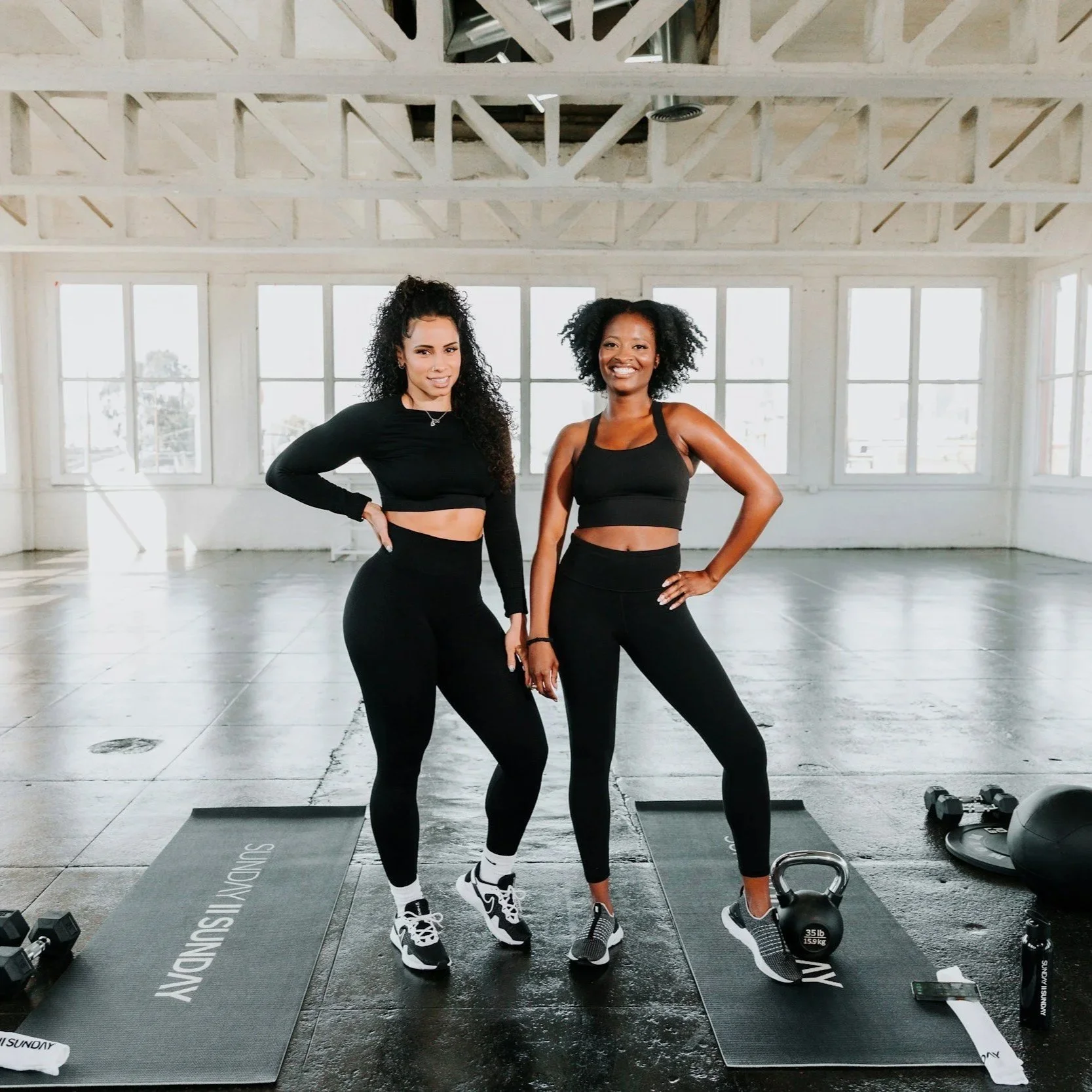 Two women working out together at a gym in Pimlico SW1