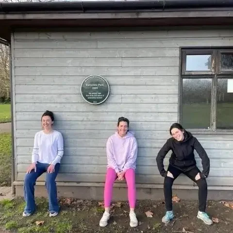 Personal trainer leading a small group workout in Battersea