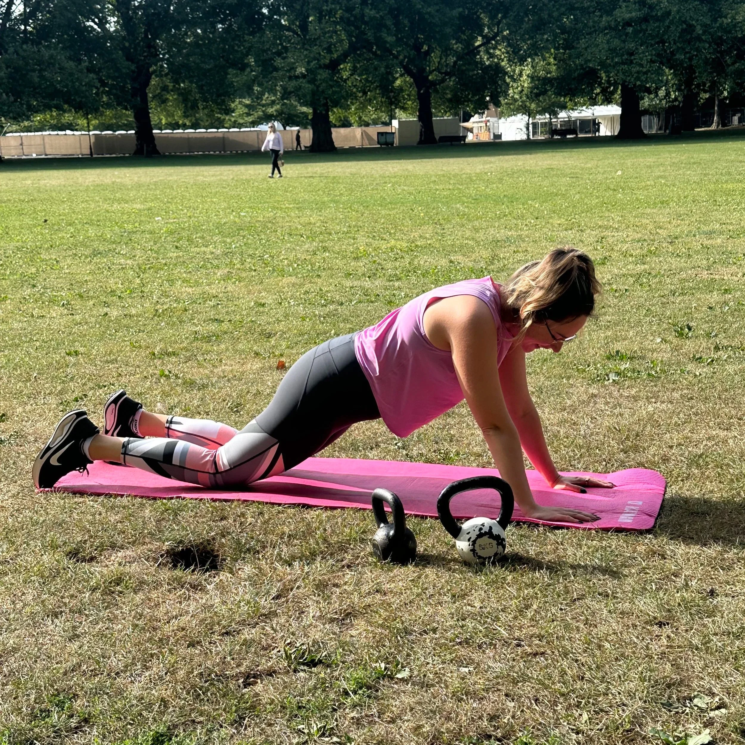 Zara Smalley performing shoulder tap plank exercise for staying fit at home in Chelsea, London