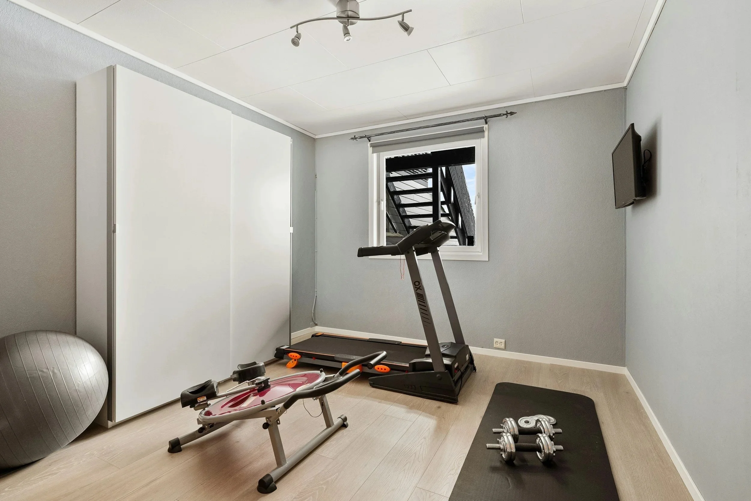 Home treadmill set-up used for cardio sessions with a mobile personal trainer in Clapham