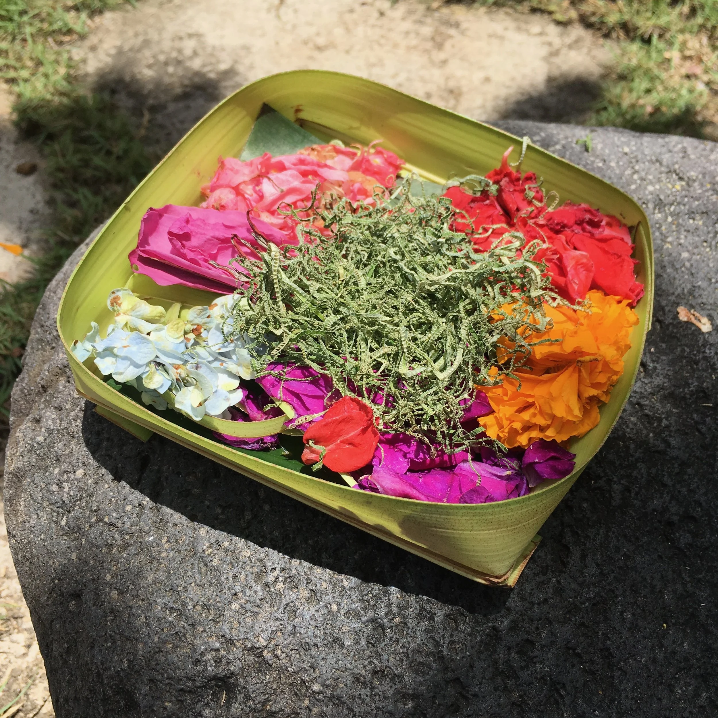 Floral offerings - often including food and a small coin - are put out every morning 