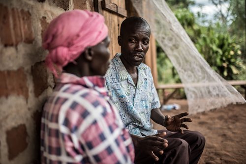 John providing counselling to one of his neighbours