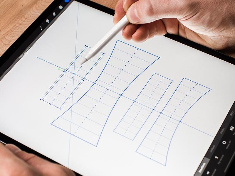 5. Help keep your lettering piece balanced by drawing a straight line down your canvas and use it to align each Grid using the top and bottom markers.