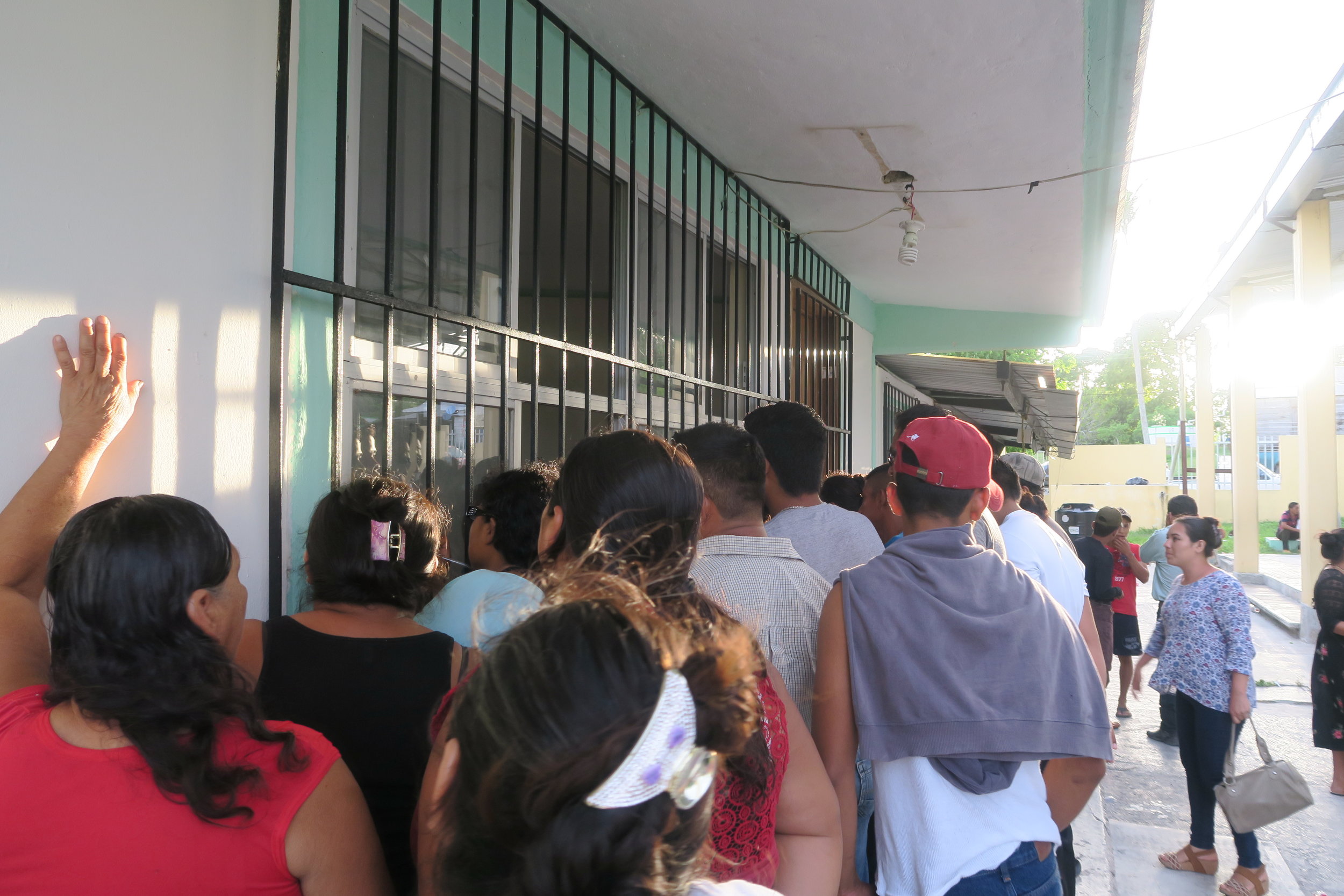 crowds monitoring the voting underway