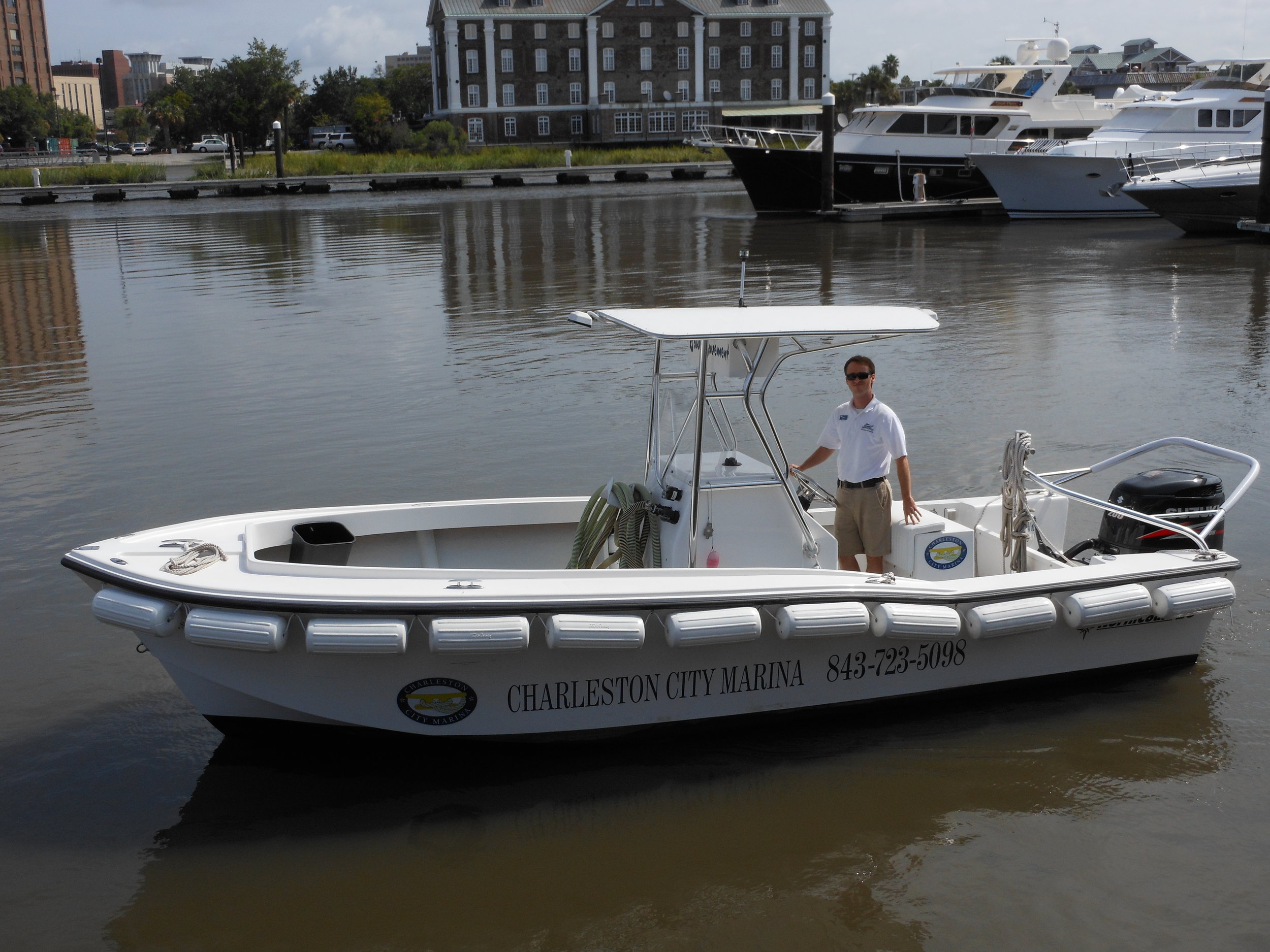 A Charleston City Marina staffer mans the Bow Movement , one of three pumpout boats at the marina where other vessels can discharge their sewage. (Photo: Scott Meister/SCDNR)
