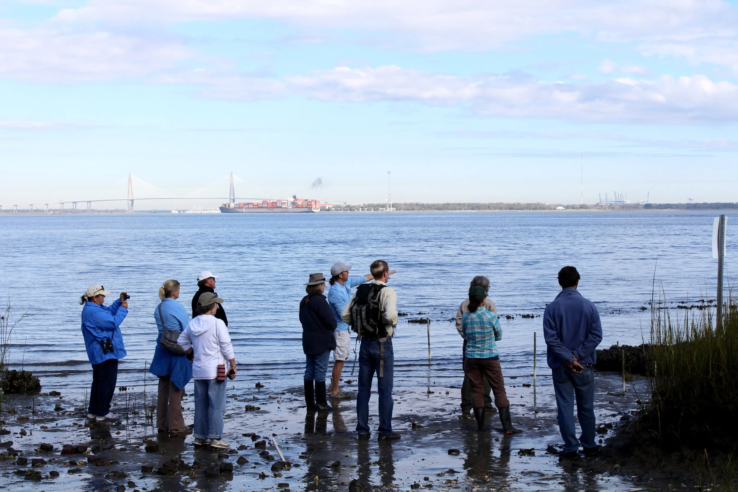 SCDNR scientist Peter Kingsley-Smith (center) tells recent workshop attendees about the different living shoreline materials his group is studying. (Photo: E. Weeks/SCDNR)