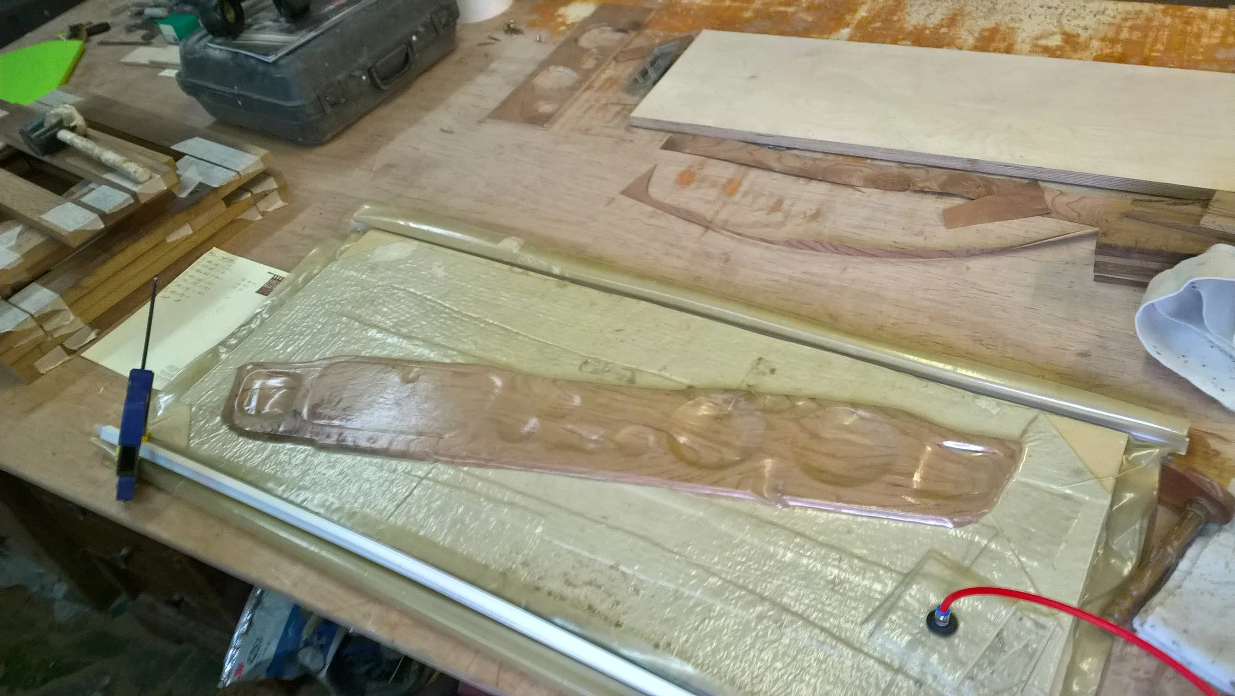 The Elm veneer is being glued to the dashboard via a vacuum press.