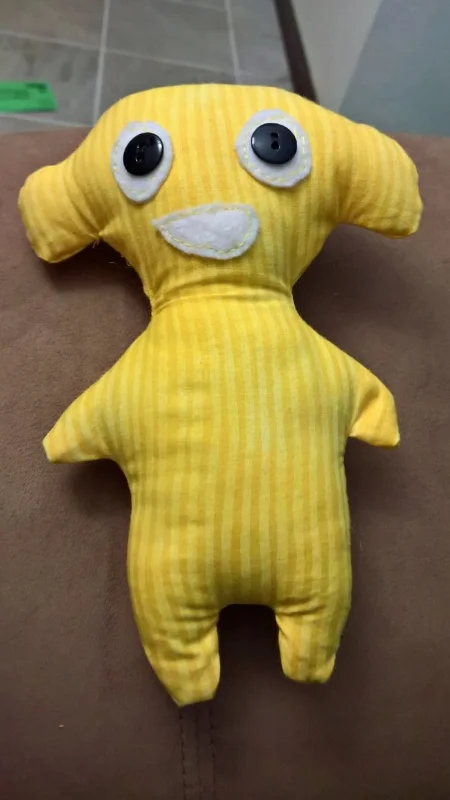 The yellow one here is prototype #2 and I think he turned out a LOT better. The eyes and mouth look much prettier, and I was able to close up the side seam so well that I'm pretty sure you won't even be able to tell where it is!