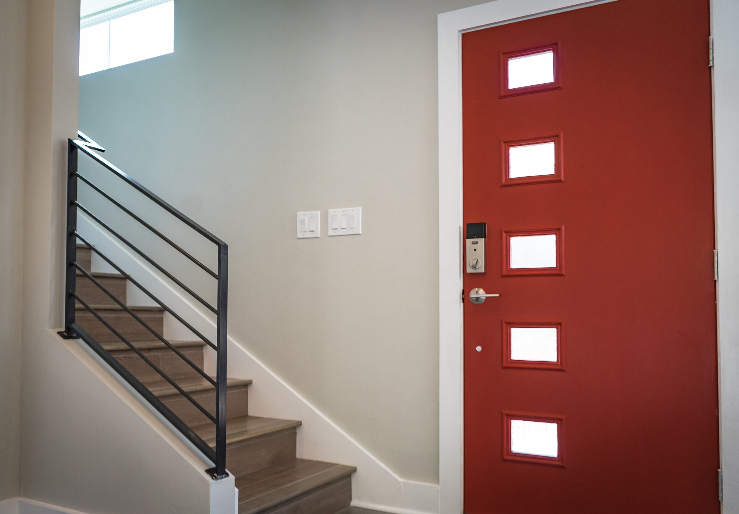 red-wooden-door-beside-stairs-922796.jpg