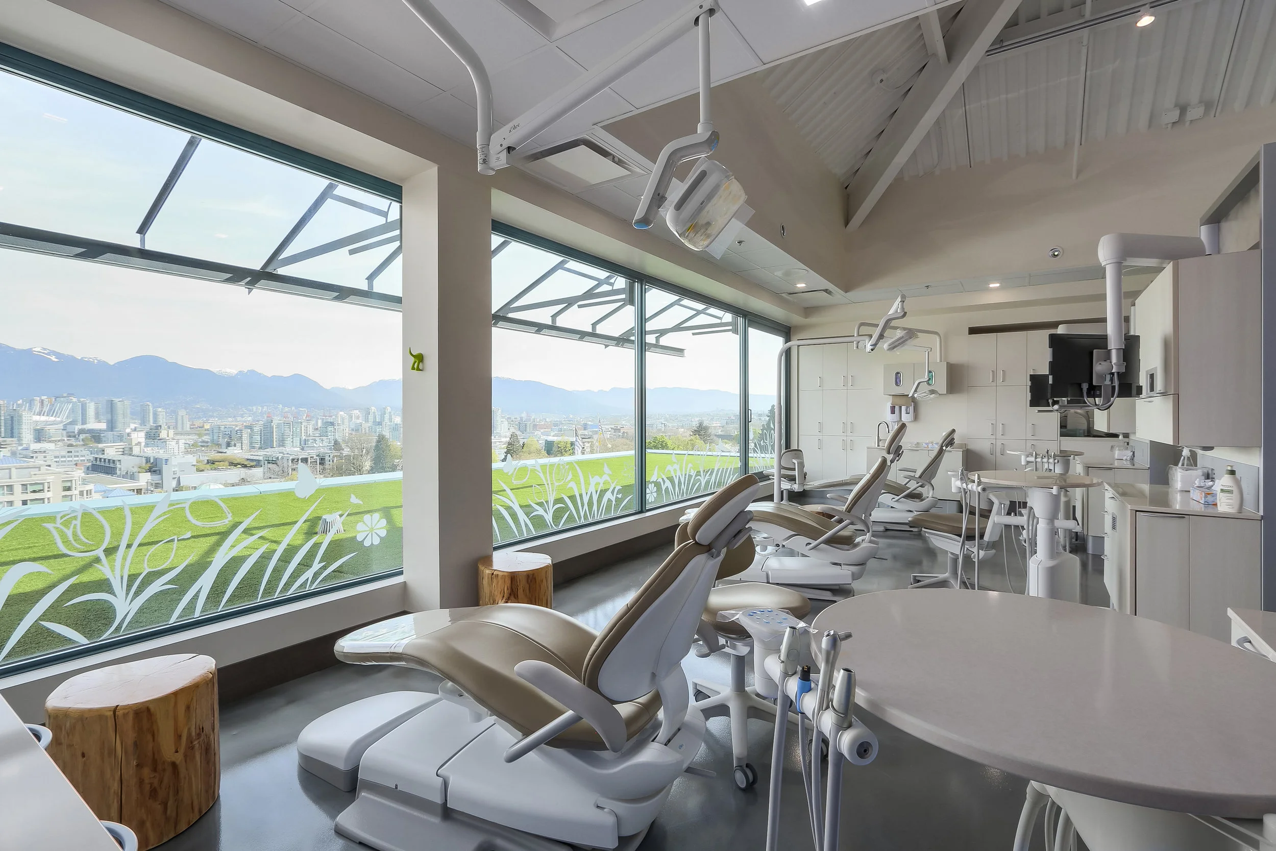 The Clinic Area has the latest equipment and is patient and parent friendly with a view of the city and a large projection screen that runs across the ceiling.