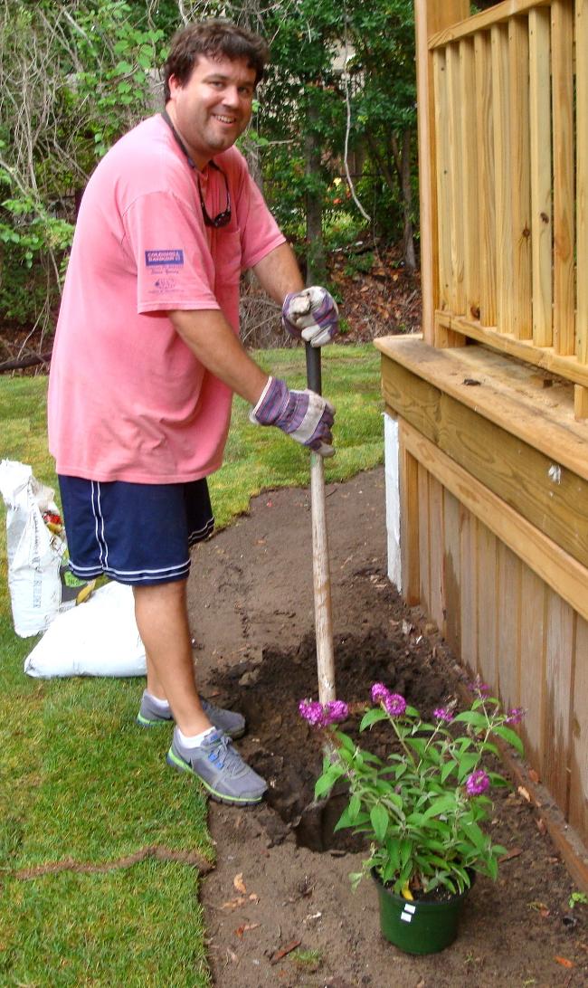 Scott Toole planting flowers.