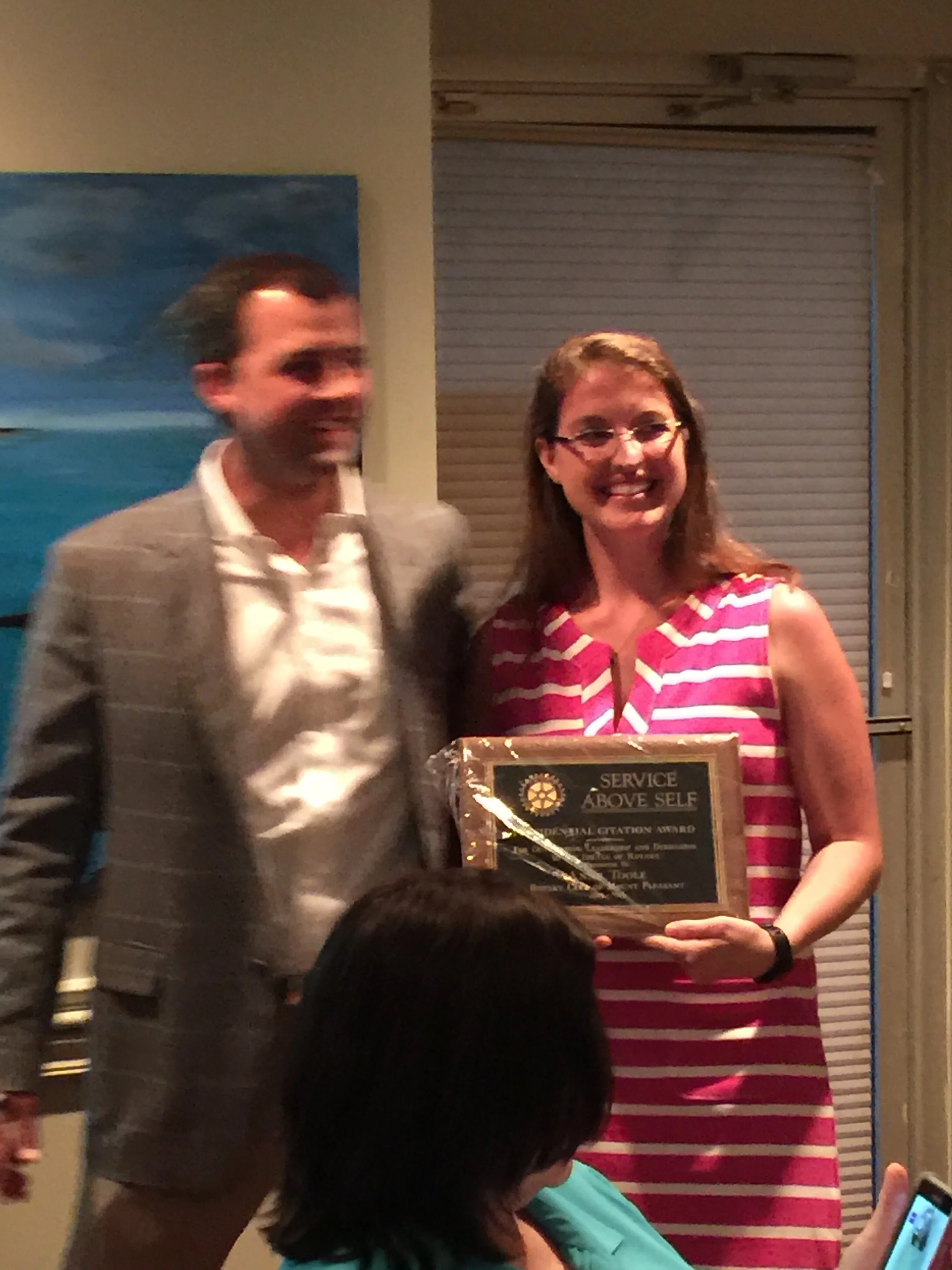 President Rob Crawford gives a much deserved "Service Above Self" award to Anne Toole.