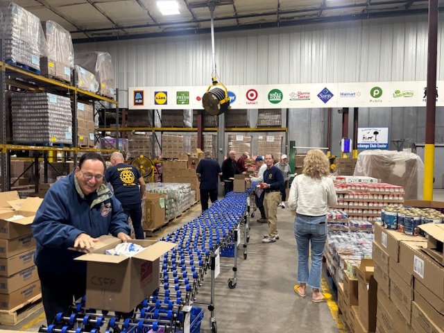 Having fun while we package lunches...