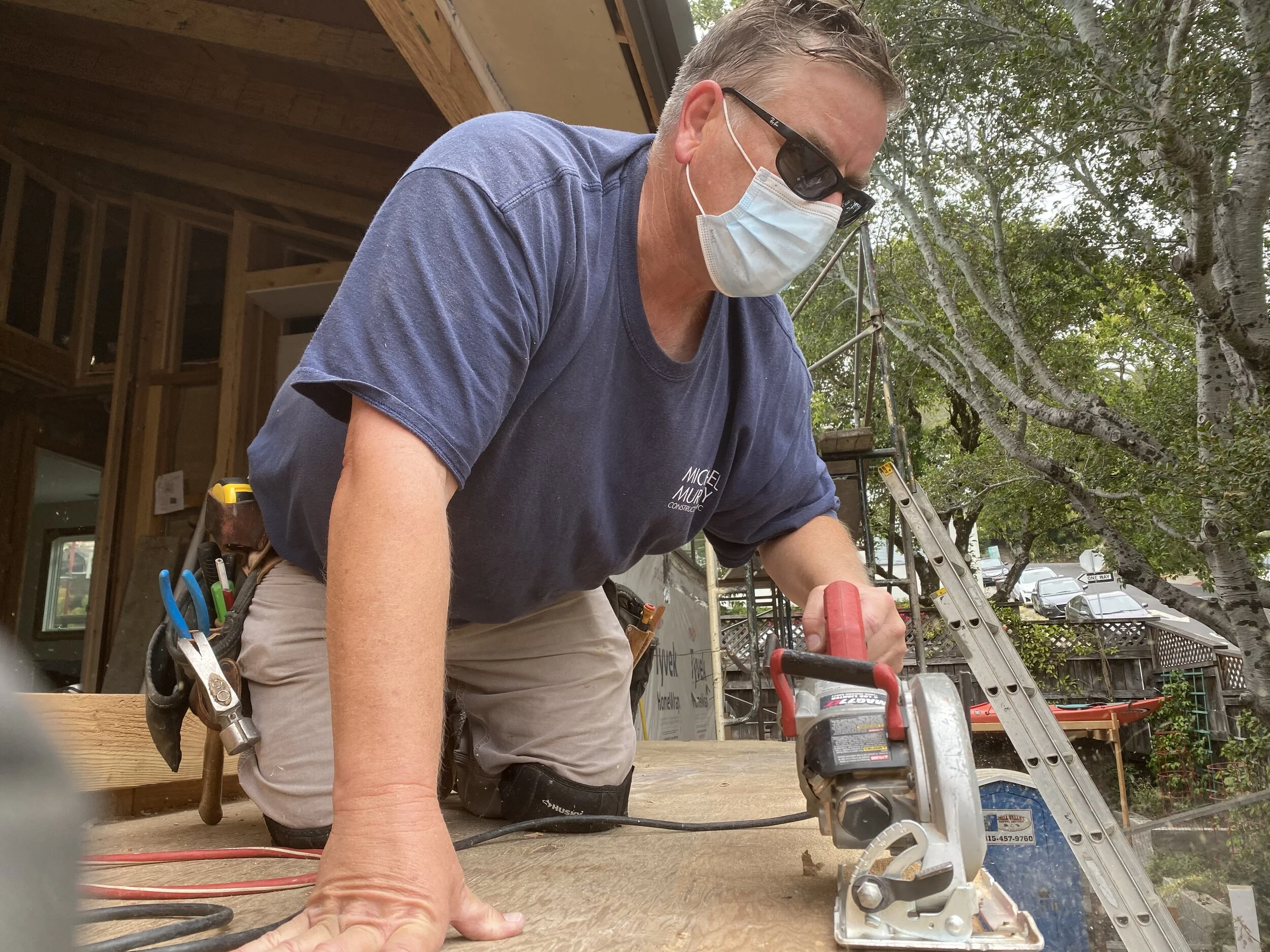 Michael on site trim off plywood decking.