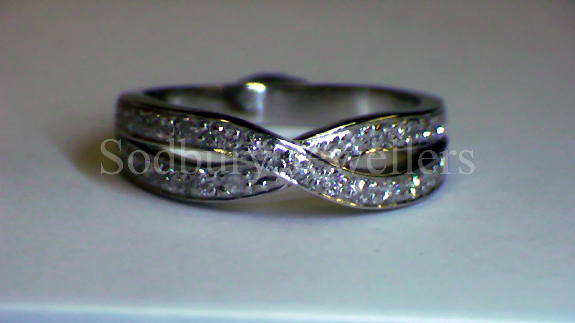 A Diamond set Platinum wedding ring.