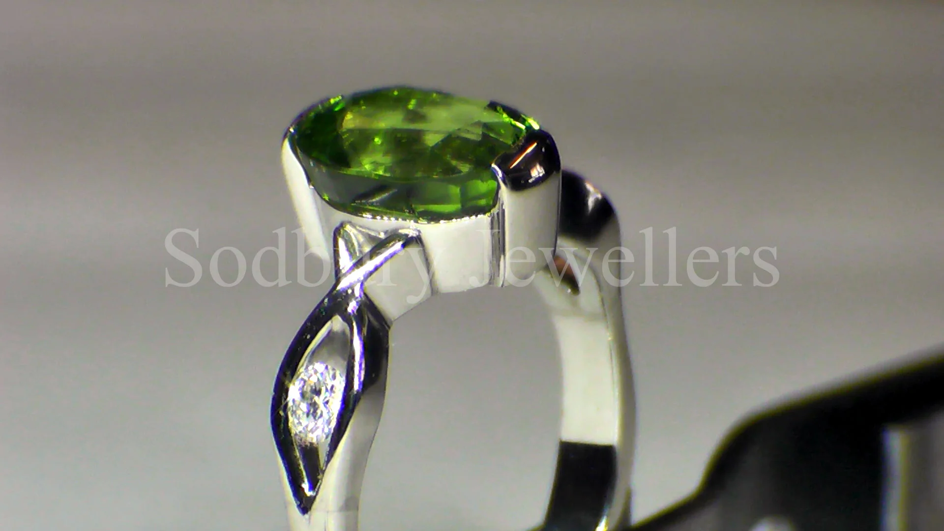 Peridot and Diamonds set into Platinum.