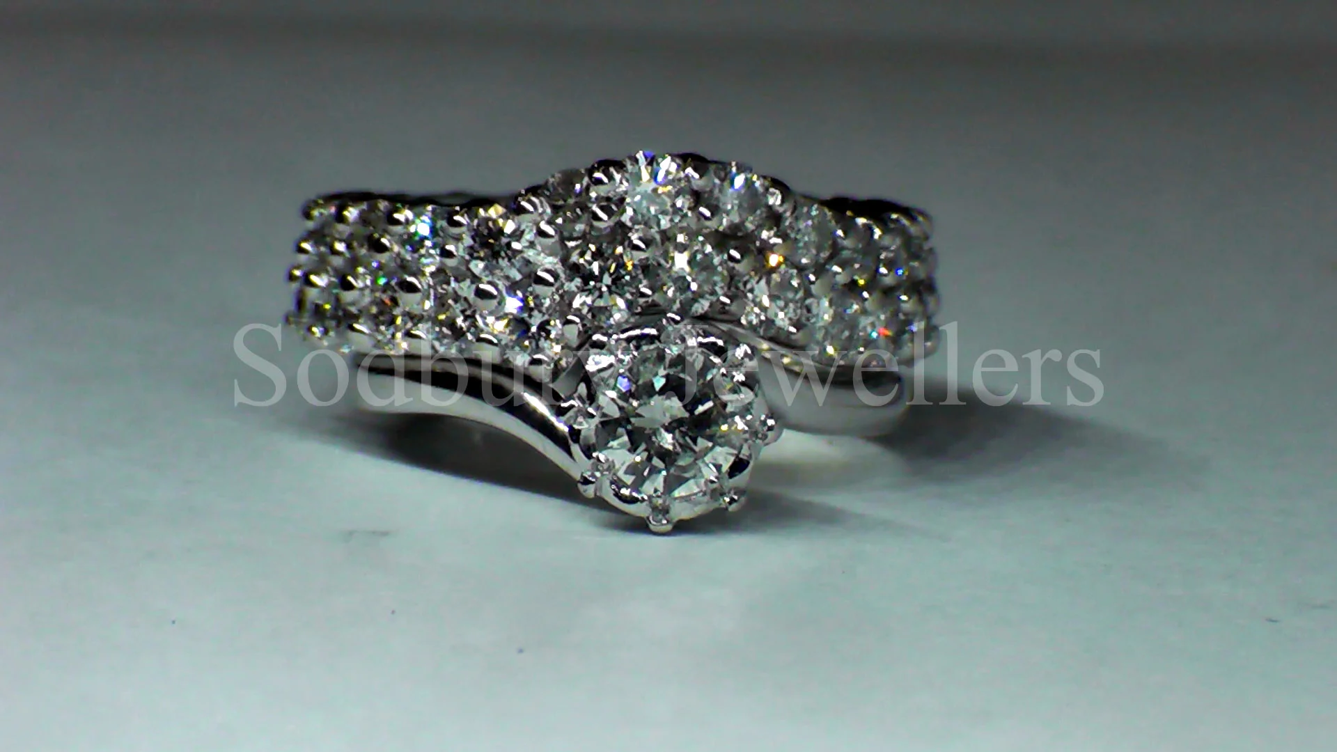 A shaped wedding ring set with 3.00cts of Diamonds.