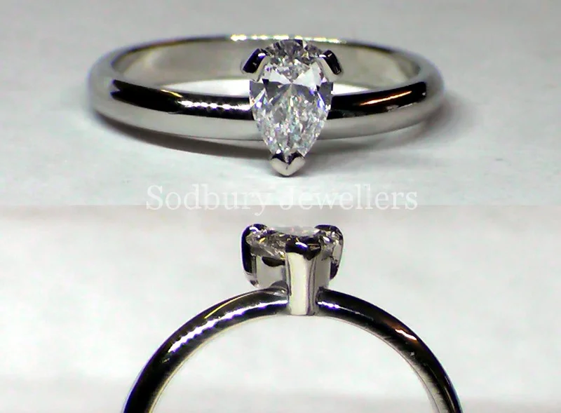Hand - made in Platinum. The Pear Diamond is 0.57cts D SI2 with a GIA certificate.
