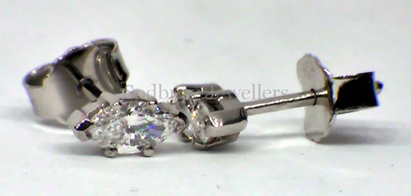 A pair of Platinum Marquise Diamond earrings.
