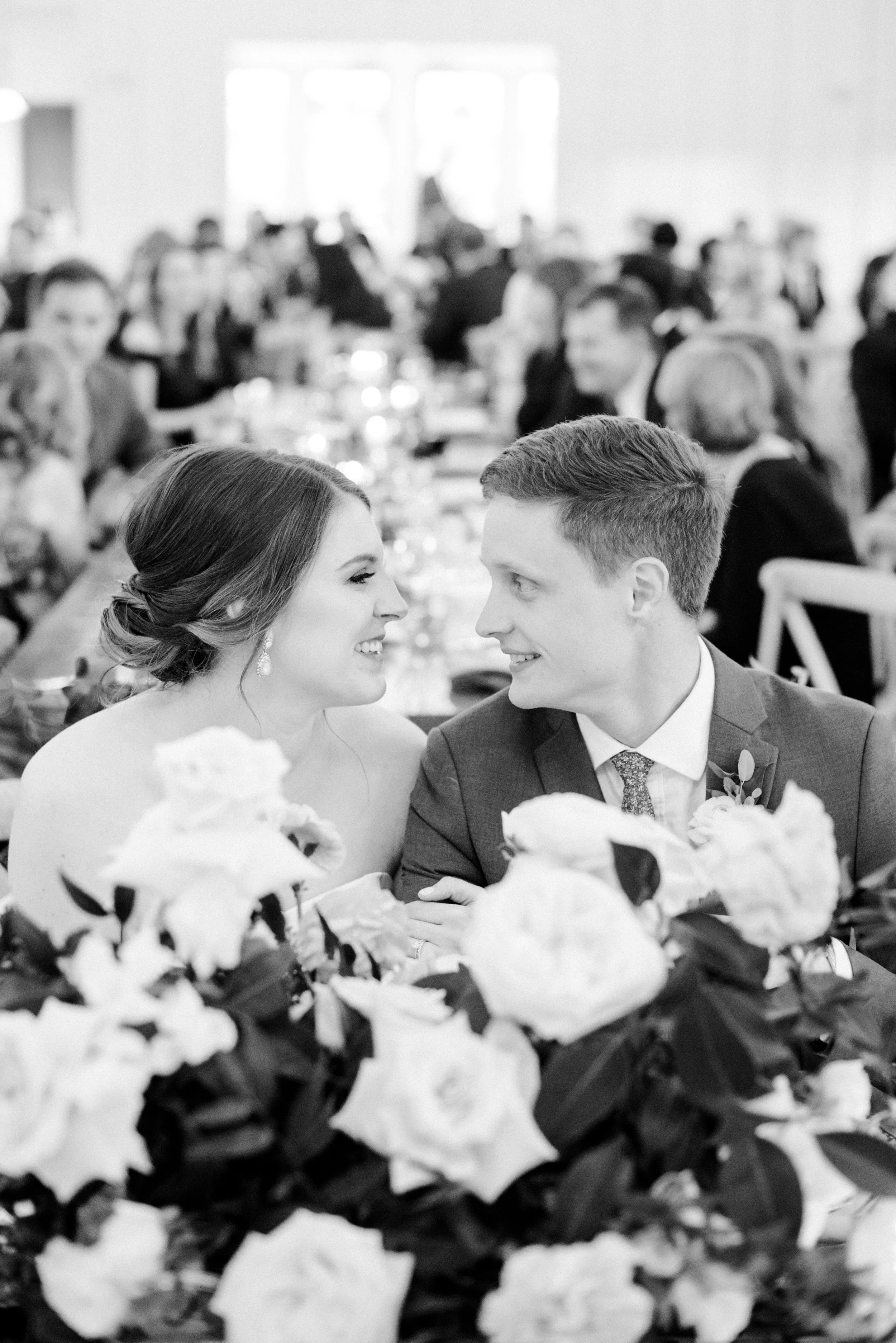 amy-and-cooper-at-head-table-ivory-and-vine-event-co.jpg