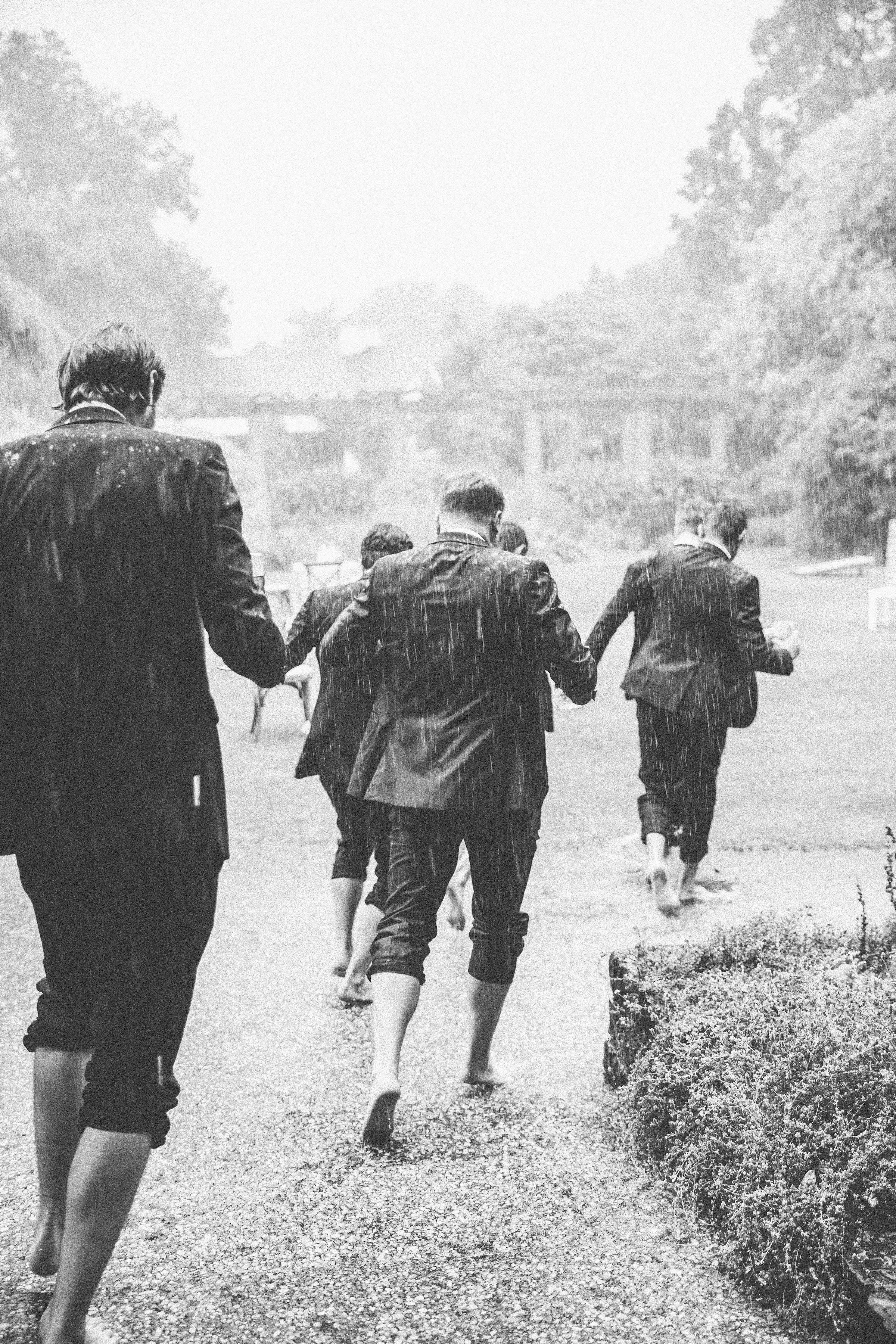 Groomsmen-Run-In-Rain-Ivory-and-Vine.jpg