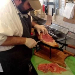 One of Kevin's most delicious memories is from a trip to visit family in Spain just after turning 21. Every bar had different tapas, but when they pulled up a stool at one in the shadow of the Alhambra, slices of dry cured ham helped make the memory. "Sitting in the night in this ancient city, with family I hadn't seen in too long, enjoying this beautiful dry cured meat, and having this amazing palace lit up across the road from us... Pretty great."